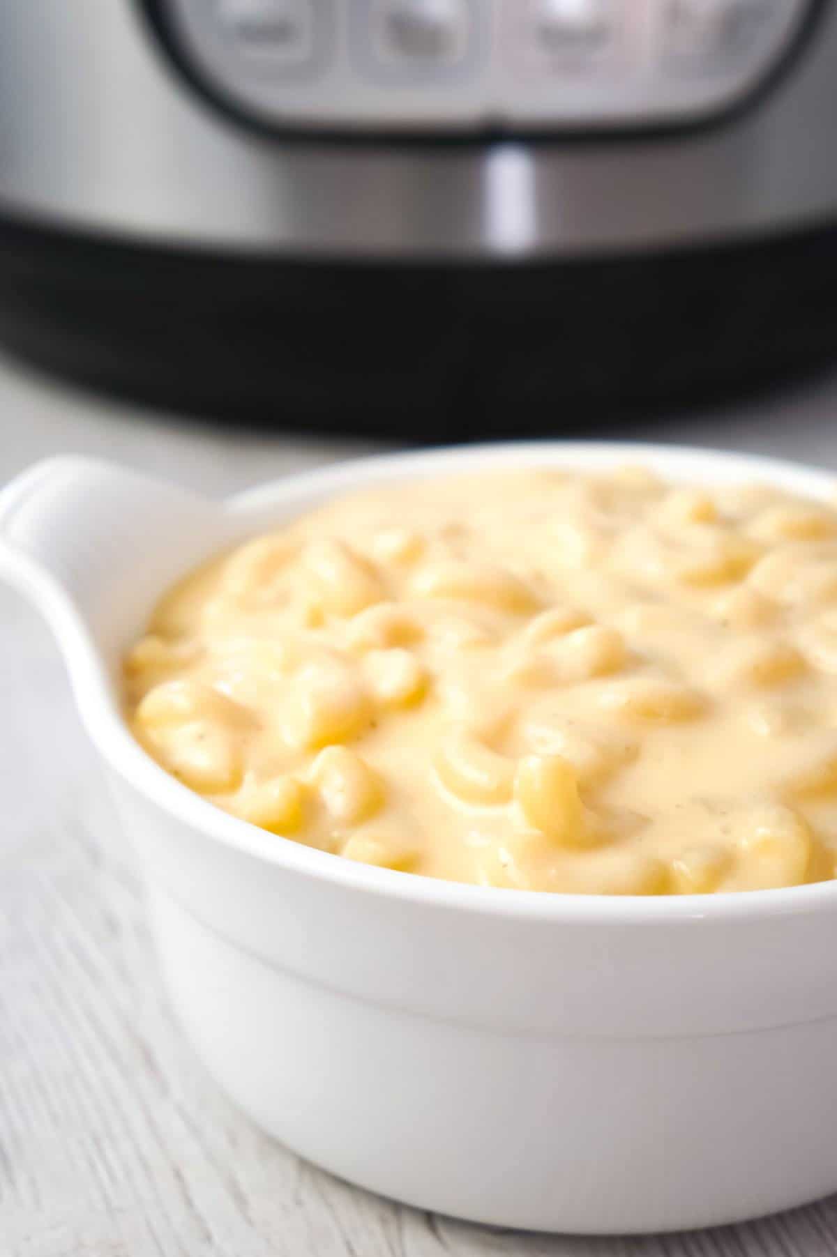 Instant Pot Extra Creamy Mac and Cheese is a simple and delicious pressure cooker pasta recipe made with cheddar cheese soup, heavy cream, mozzarella and cheddar cheese.