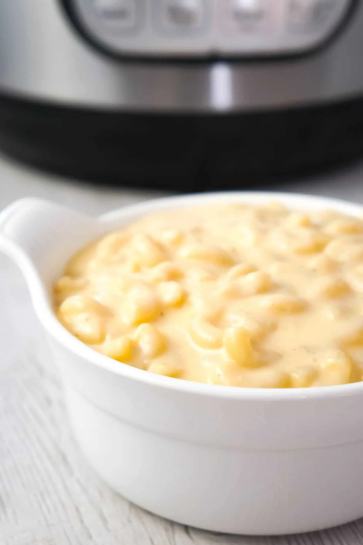 Instant Pot Extra Creamy Mac and Cheese is a simple and delicious pressure cooker pasta recipe made with cheddar cheese soup, heavy cream, mozzarella and cheddar cheese.