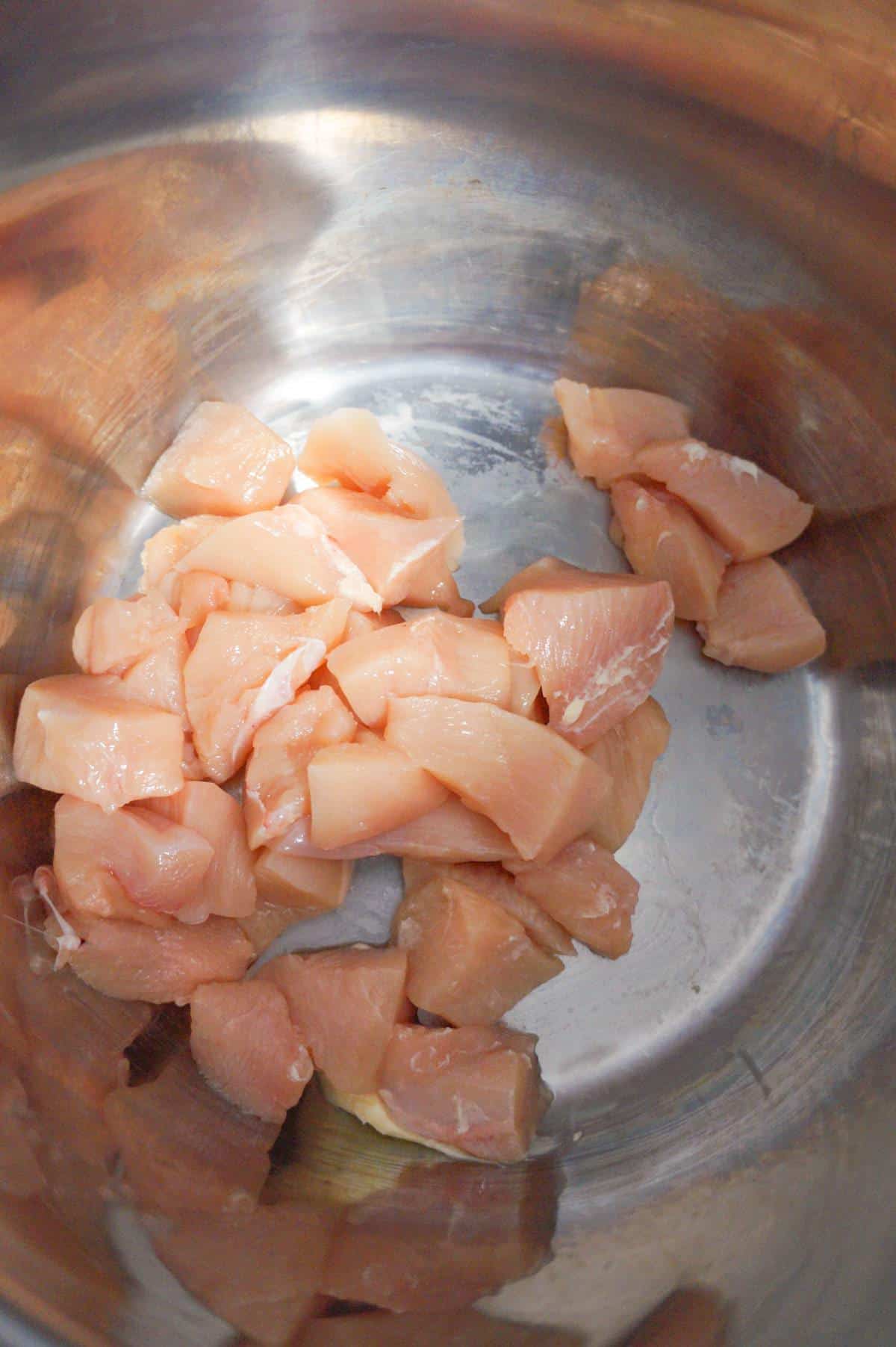 raw chicken breast chunks in an Instant Pot