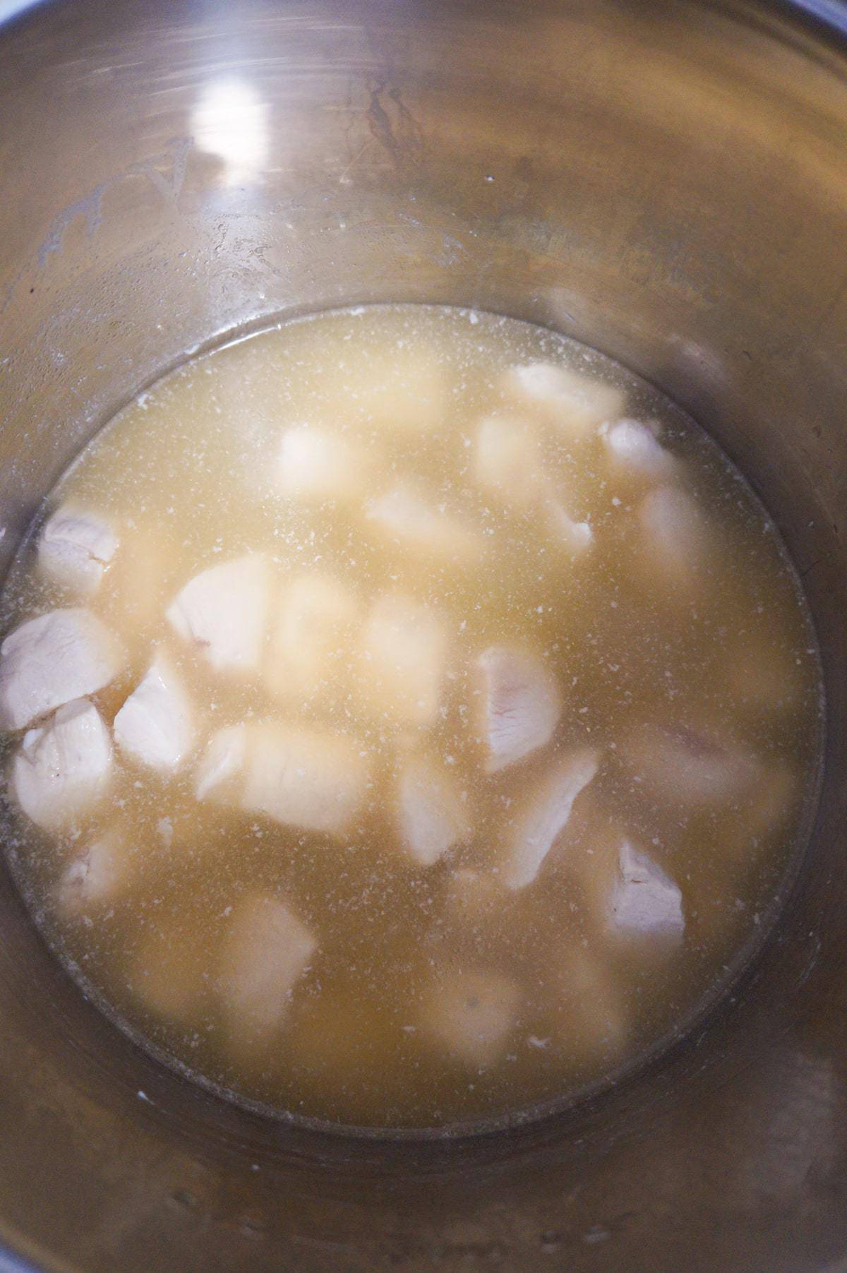 chicken breast chunks in broth in an Instant Pot