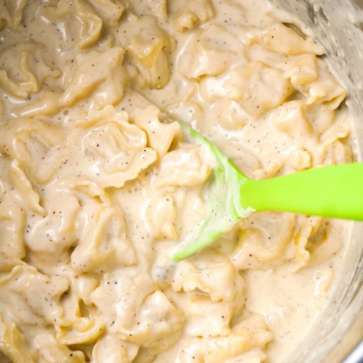 Instant Pot Tortellini Alfredo is a delicious pressure cooker pasta recipe made with refrigerated three cheese tortellini, garlic puree, heavy cream, mozzarella and Parmesan cheese.