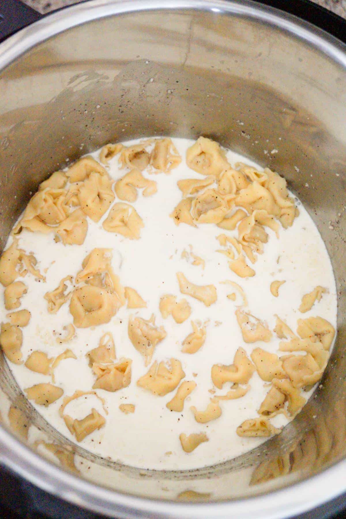 heavy cream added to tortellini pasta in an Instant Pot