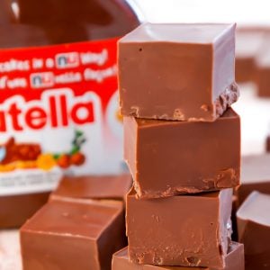 Nutella Fudge is an easy two ingredient microwave fudge recipe using Nutella and milk chocolate chips.