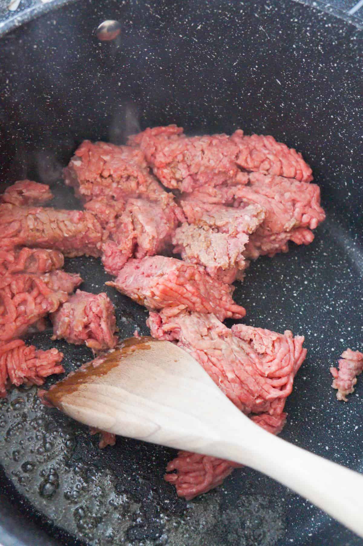 raw ground beef in a pot