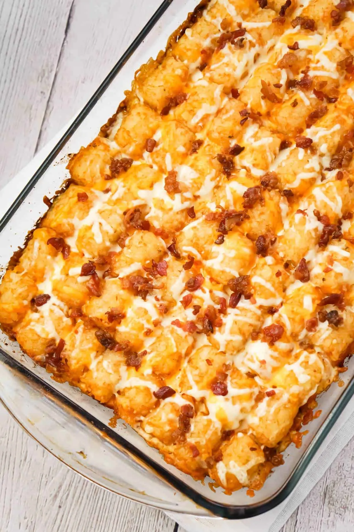 Bacon Cheeseburger Tater Tot Casserole is an easy ground beef dinner recipe loaded with crumbled bacon and cheese, and topped with crispy tater tots.