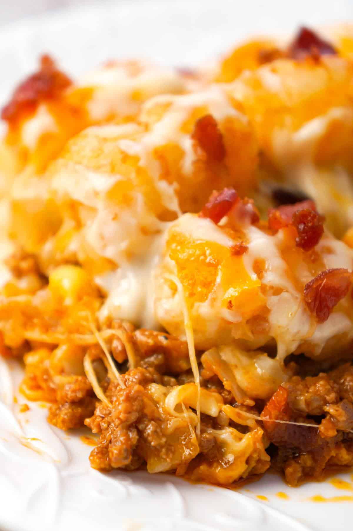 Bacon Cheeseburger Tater Tot Casserole is an easy ground beef dinner recipe loaded with crumbled bacon and cheese, and topped with crispy tater tots.