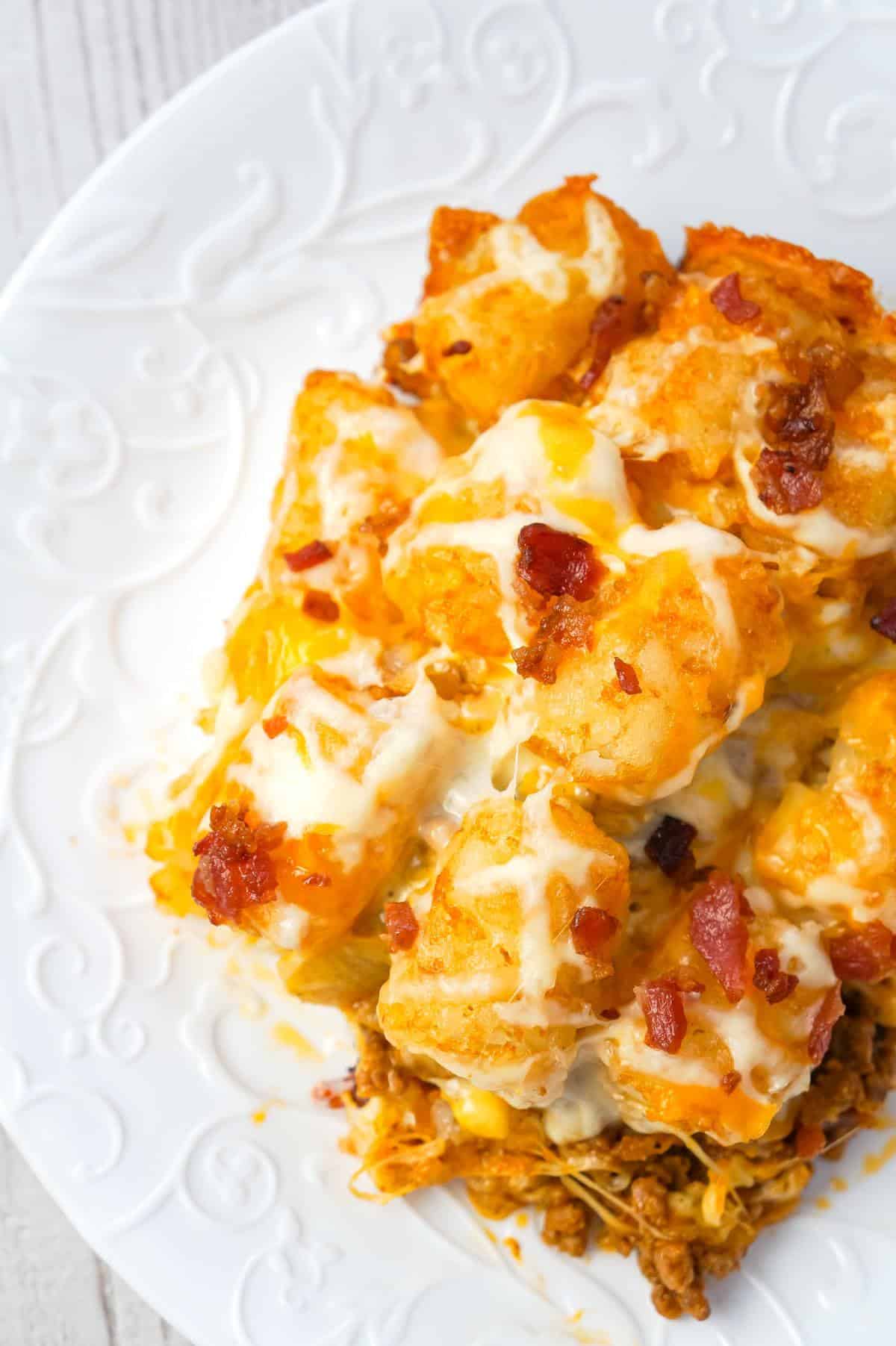 Bacon Cheeseburger Tater Tot Casserole is an easy ground beef dinner recipe loaded with crumbled bacon and cheese, and topped with crispy tater tots.