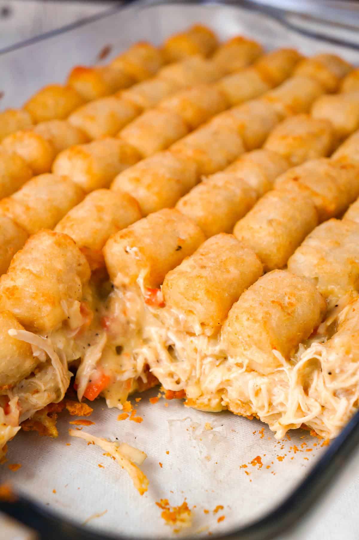 Chicken Pot Pie Tater Tot Casserole is an easy dinner recipe using shredded rotisserie chicken tossed with cream of chicken soup and mixed veggies all topped with tater tots.