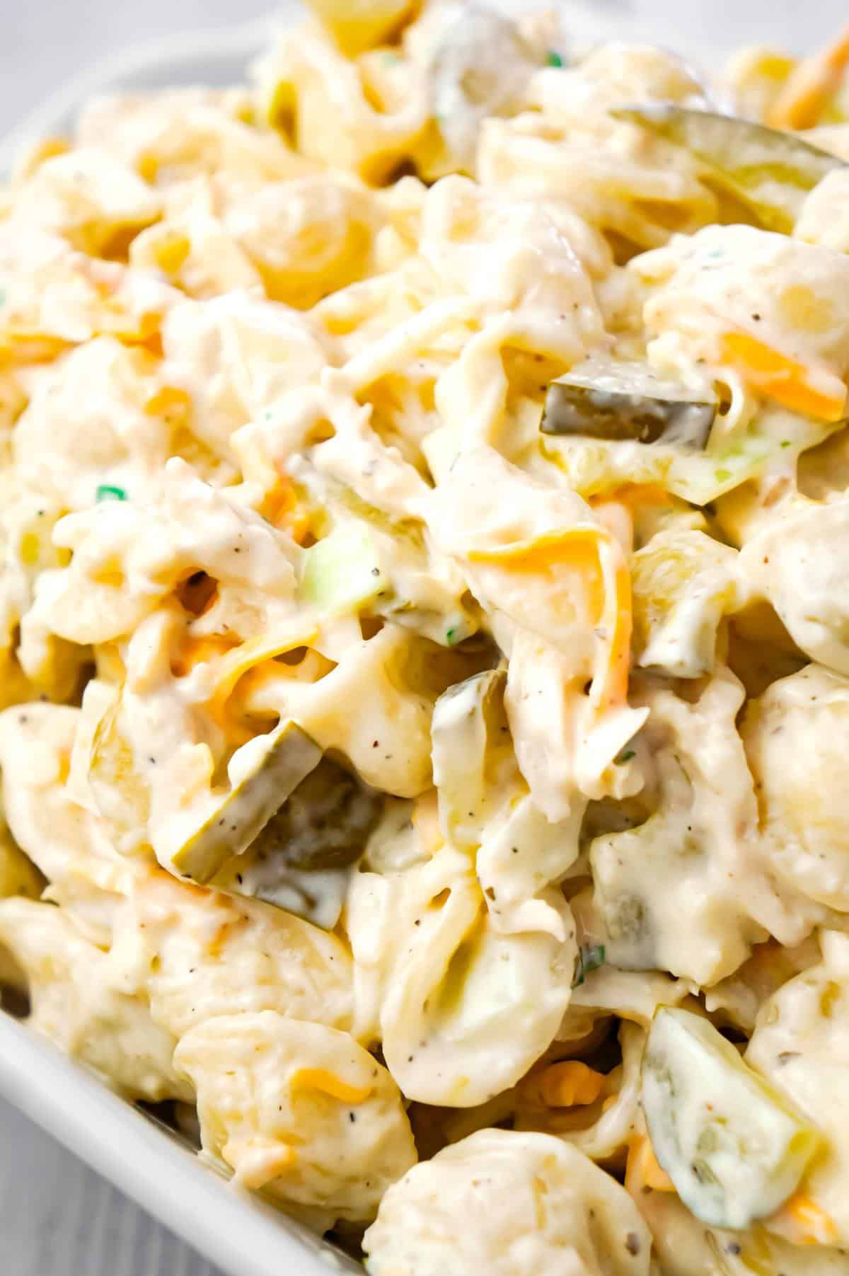 Dill Pickle Chicken Pasta Salad is a delicious cold side dish recipe loaded with shredded chicken, diced dill pickles, mayo, ranch dressing and shredded cheese.