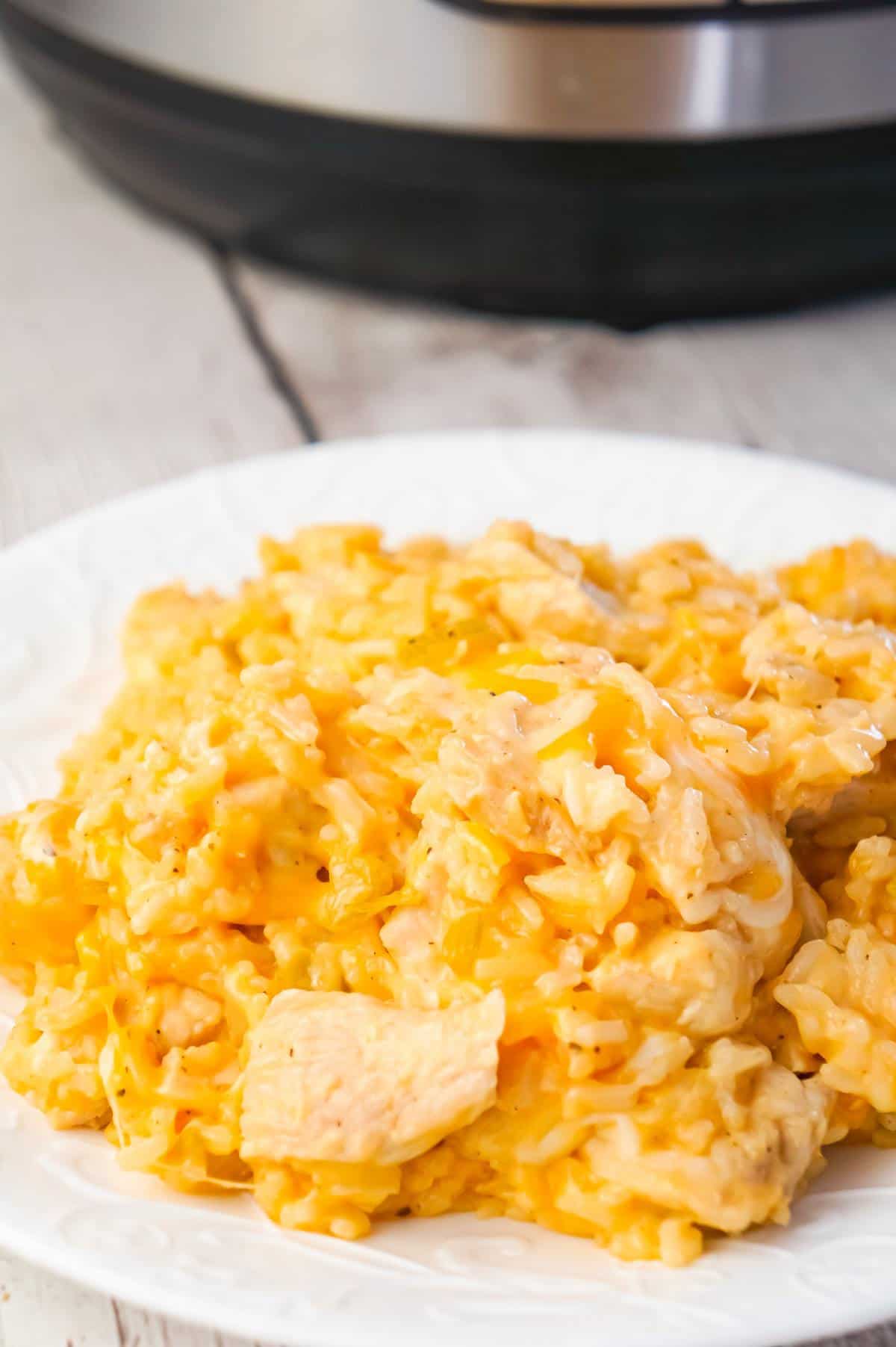 Instant Pot Cheesy Buffalo Chicken and Rice is an easy pressure cooker dinner recipe loaded with chicken breast chunks, long grain white rice, diced celery, buffalo sauce and shredded cheese.