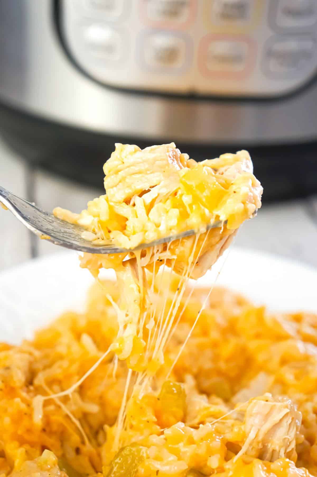Instant Pot Cheesy Buffalo Chicken and Rice is an easy pressure cooker dinner recipe loaded with chicken breast chunks, long grain white rice, diced celery, buffalo sauce and shredded cheese.