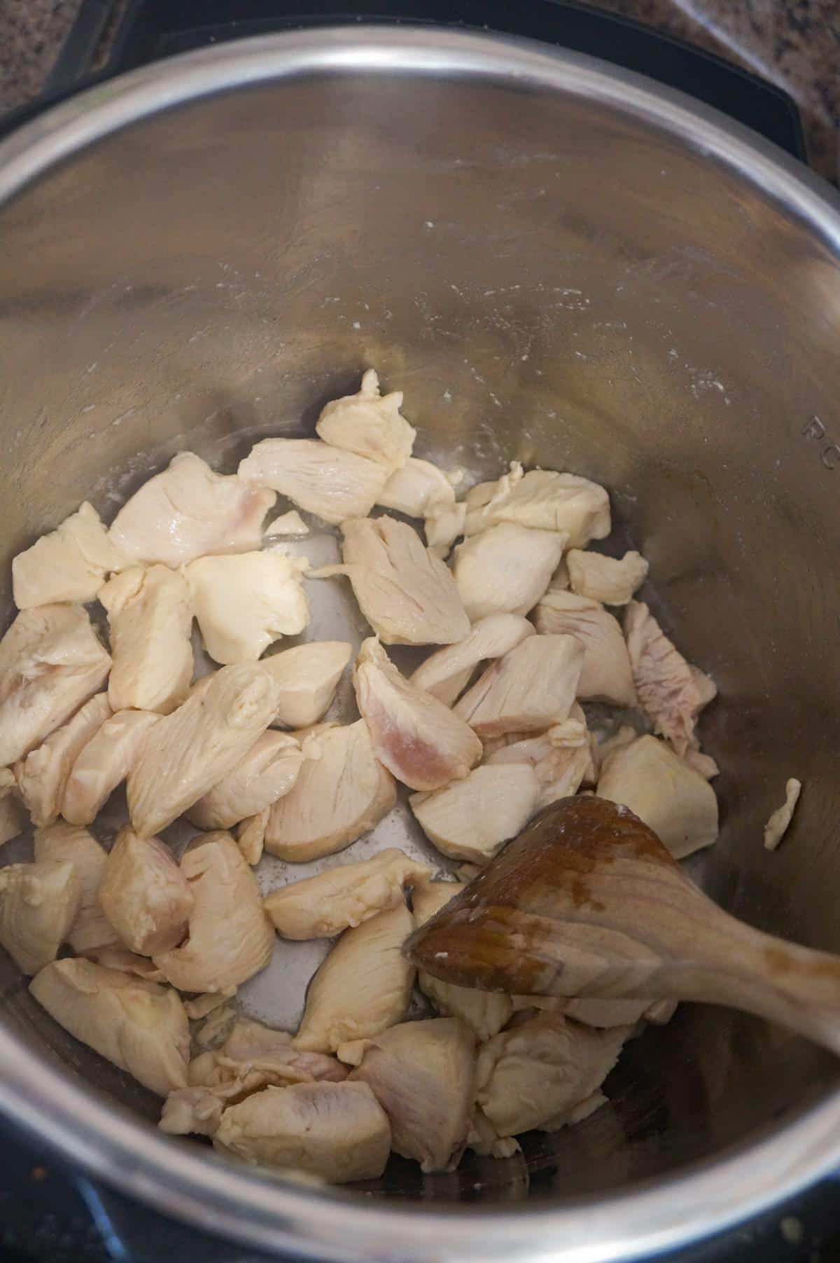 chicken breast chunks cooking in an Instant Pot