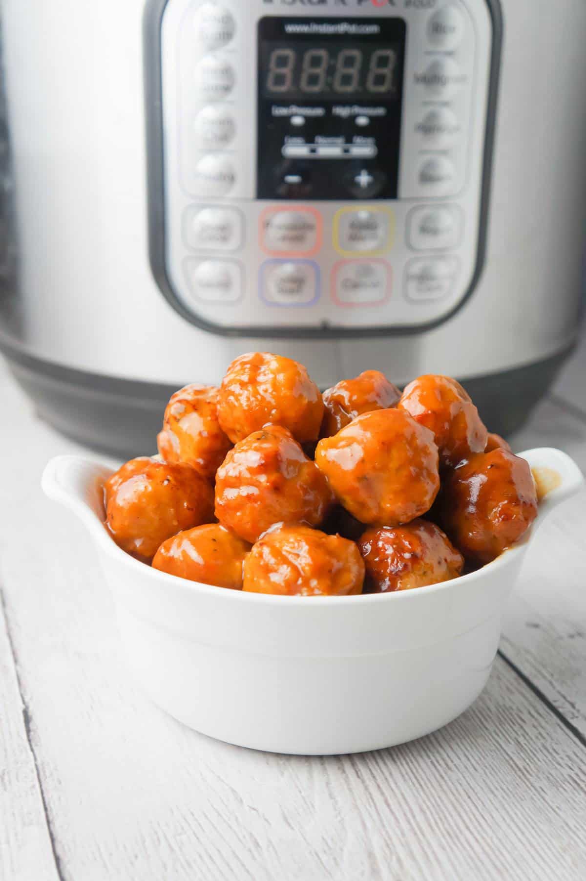 Instant Pot Cranberry Mustard Turkey Meatballs are a delicious party food recipe made with frozen turkey meatballs, jellied cranberry sauce, yellow mustard and liquid honey.