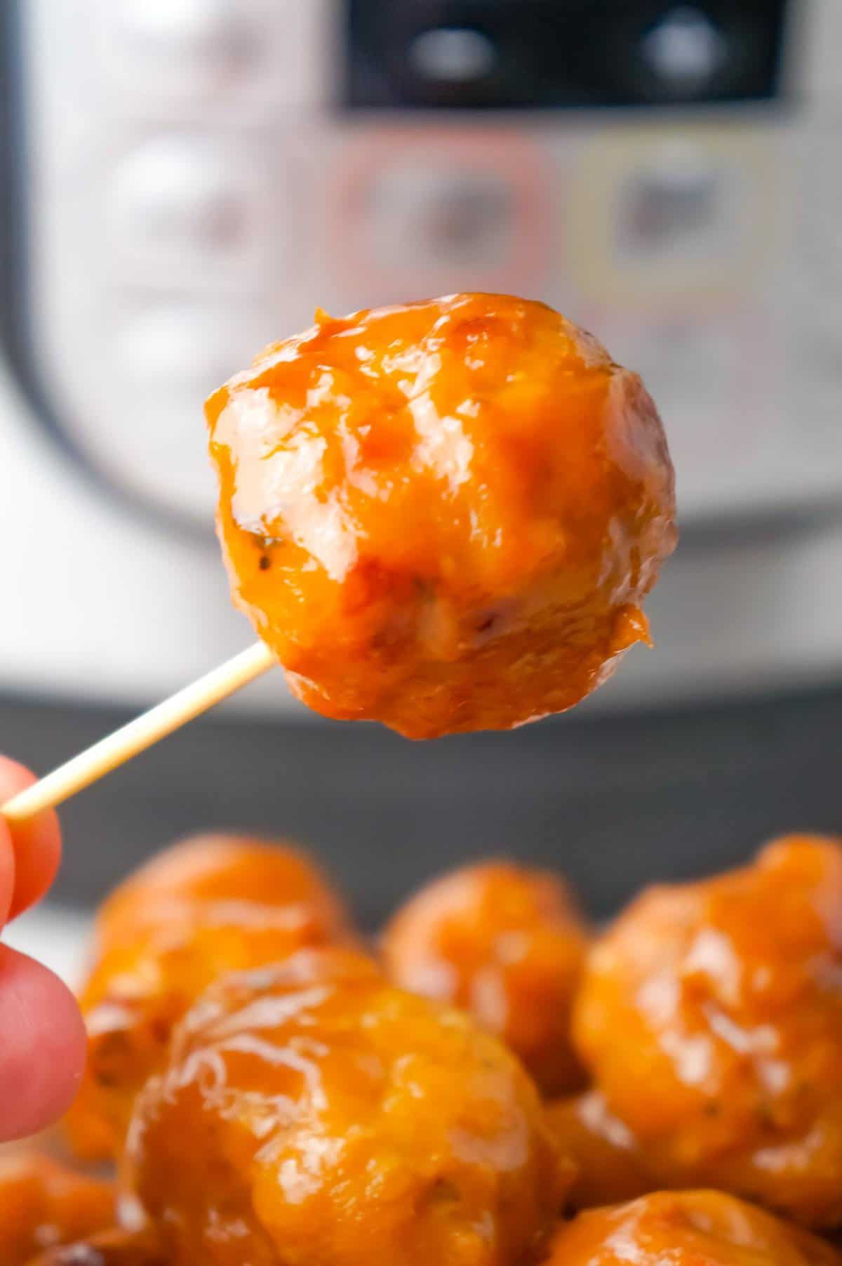 Instant Pot Cranberry Mustard Turkey Meatballs are a delicious party food recipe made with frozen turkey meatballs, jellied cranberry sauce, yellow mustard and liquid honey.
