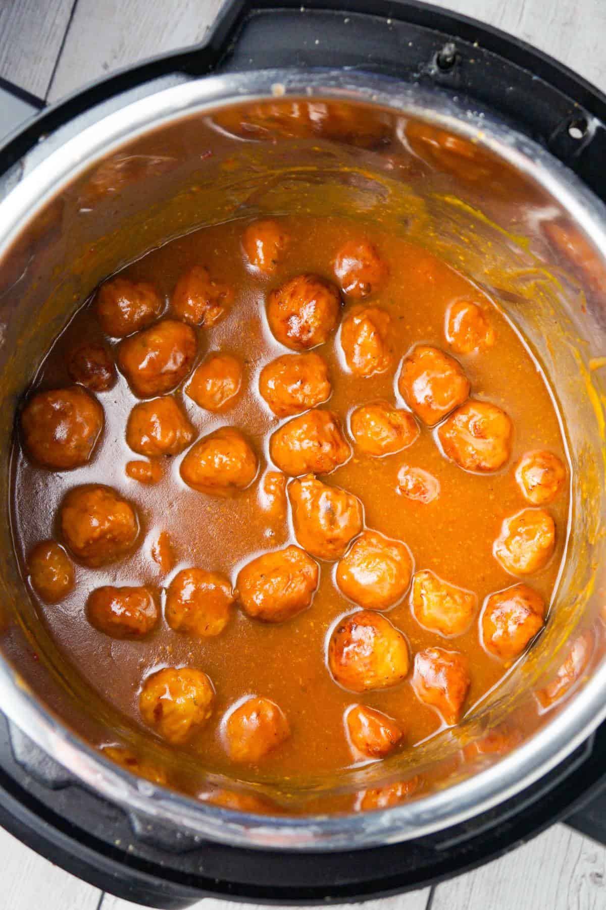 Instant Pot Cranberry Mustard Turkey Meatballs are a delicious party food recipe made with frozen turkey meatballs, jellied cranberry sauce, yellow mustard and liquid honey.