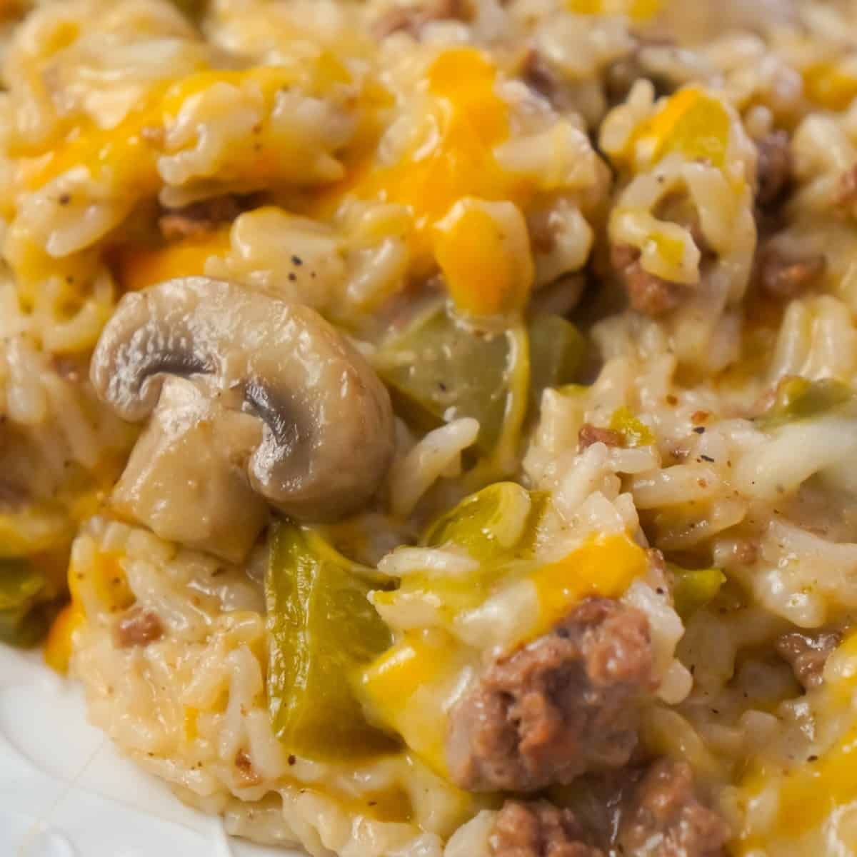 Instant Pot Philly Cheese Steak Ground Beef and Rice is an easy ground beef dinner recipe loaded with long grain white rice, green peppers, onions, mushrooms and shredded cheese.