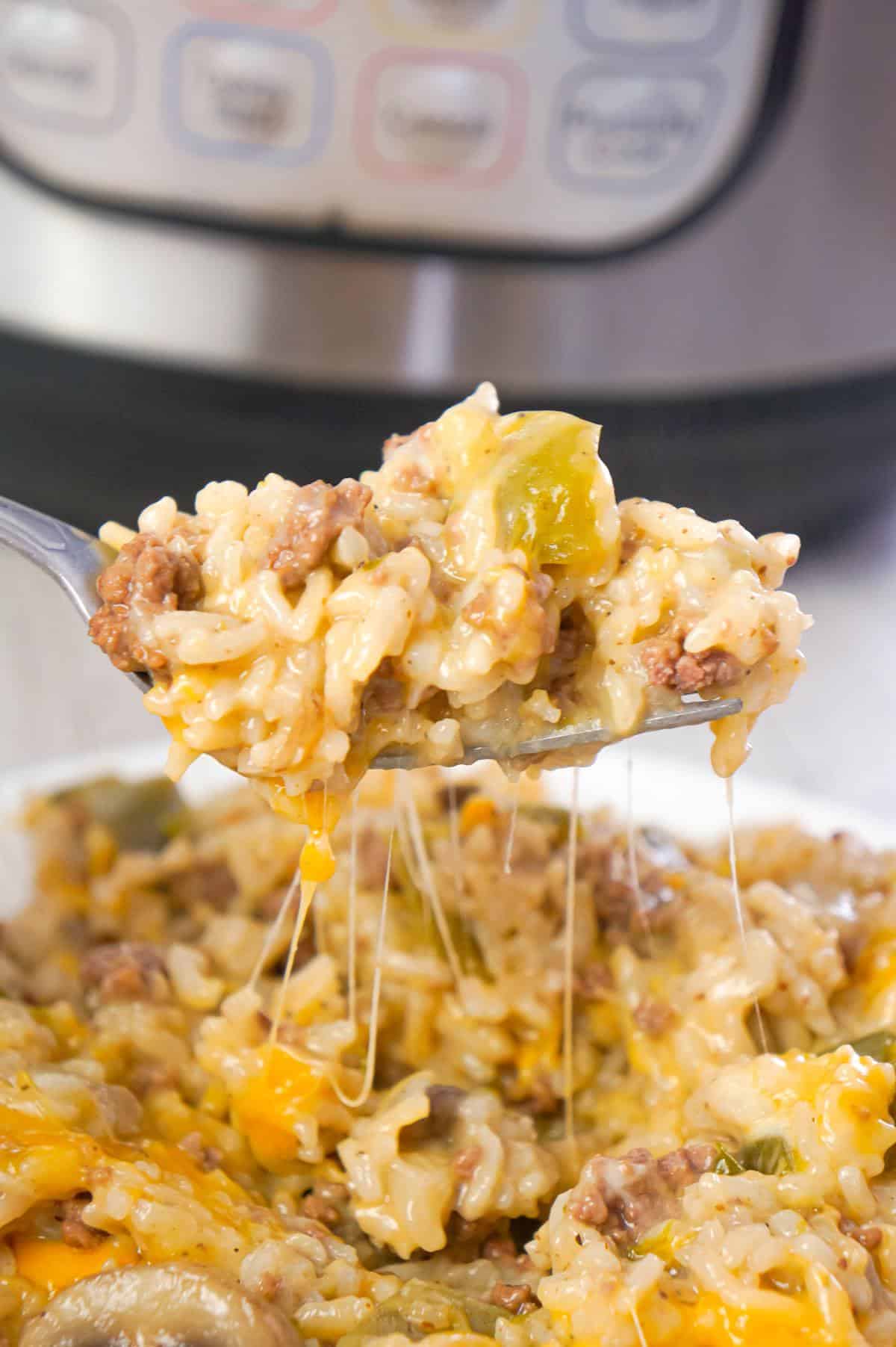 Instant Pot Philly Cheese Steak Ground Beef and Rice is an easy ground beef dinner recipe loaded with long grain white rice, green peppers, onions, mushrooms and shredded cheese.