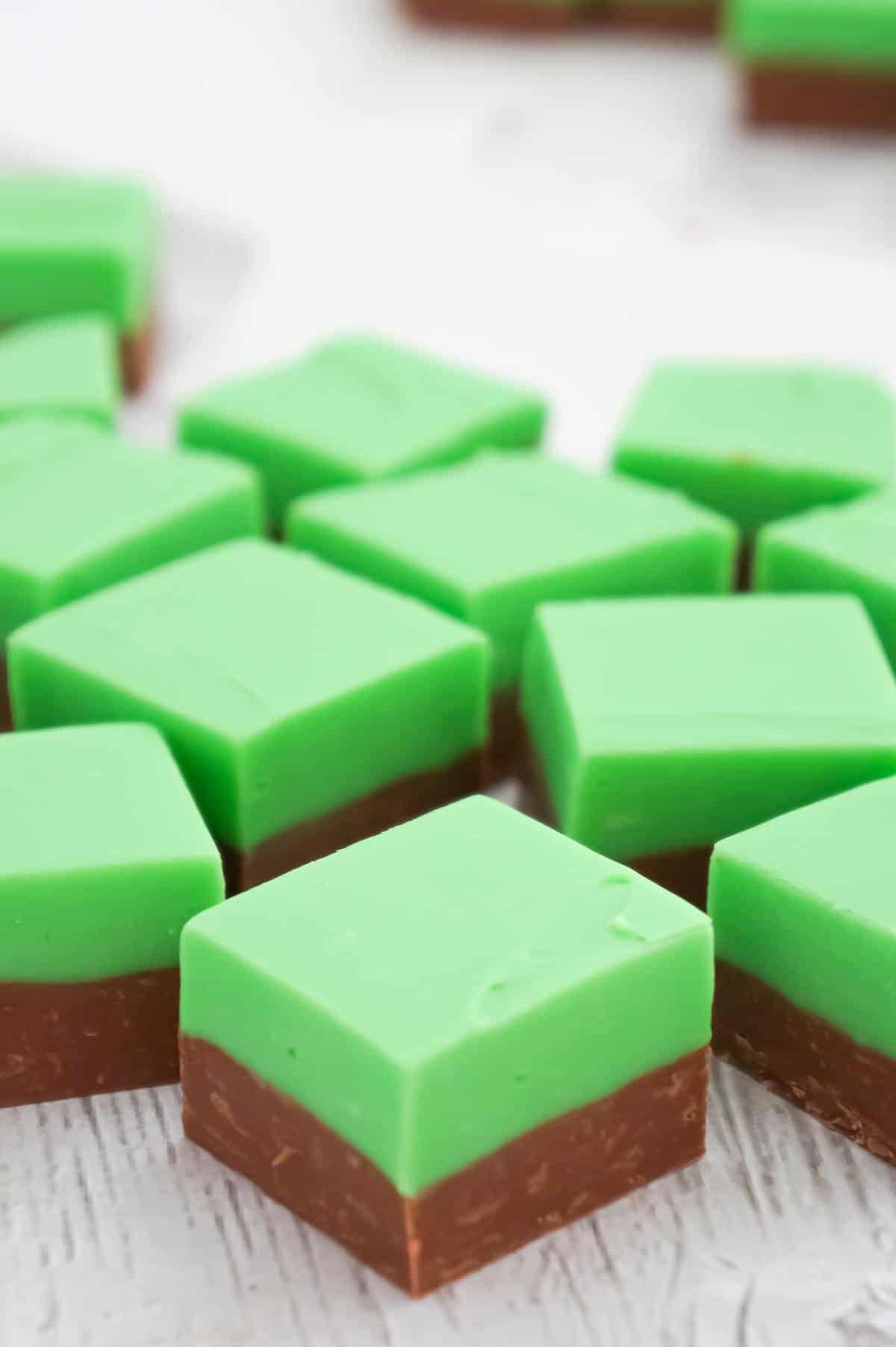 Mint Chocolate Fudge is an easy microwave fudge recipe using sweetened condensed milk, milk chocolate chips, white chocolate chips, green food colouring and mint extract.