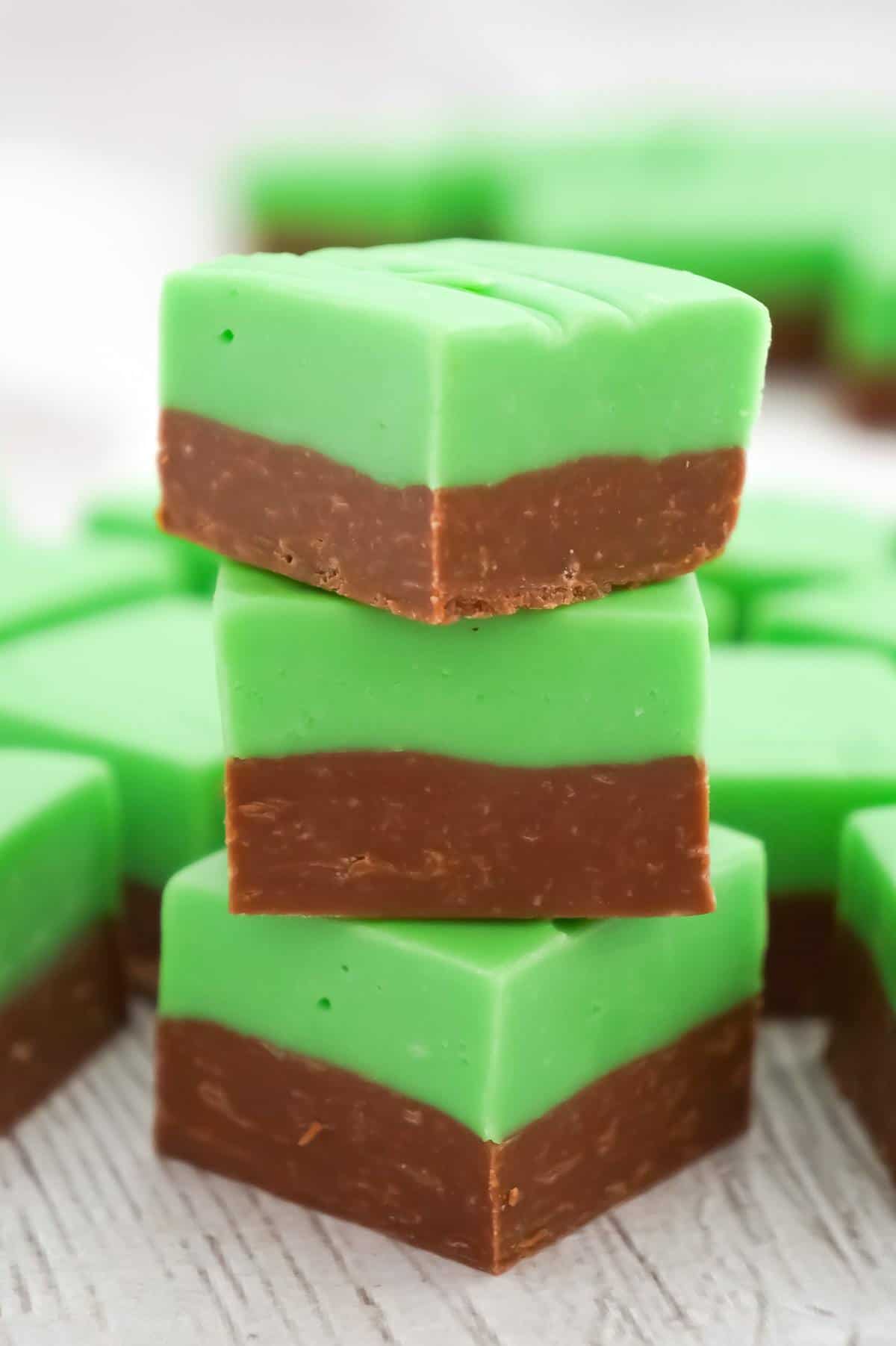 Mint Chocolate Fudge is an easy microwave fudge recipe using sweetened condensed milk, milk chocolate chips, white chocolate chips, green food colouring and mint extract.