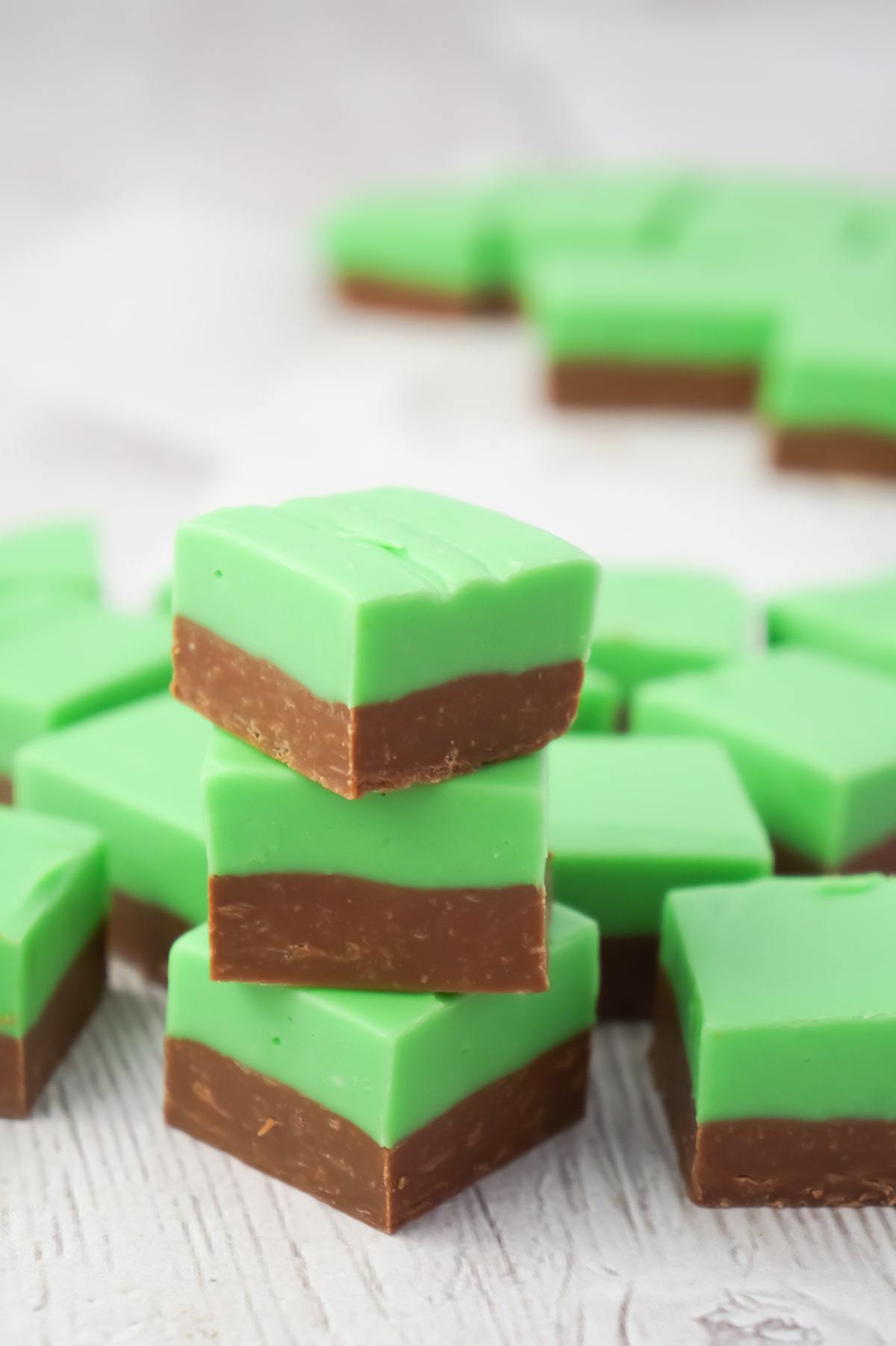 Mint Chocolate Fudge is an easy microwave fudge recipe using sweetened condensed milk, milk chocolate chips, white chocolate chips, green food colouring and mint extract.