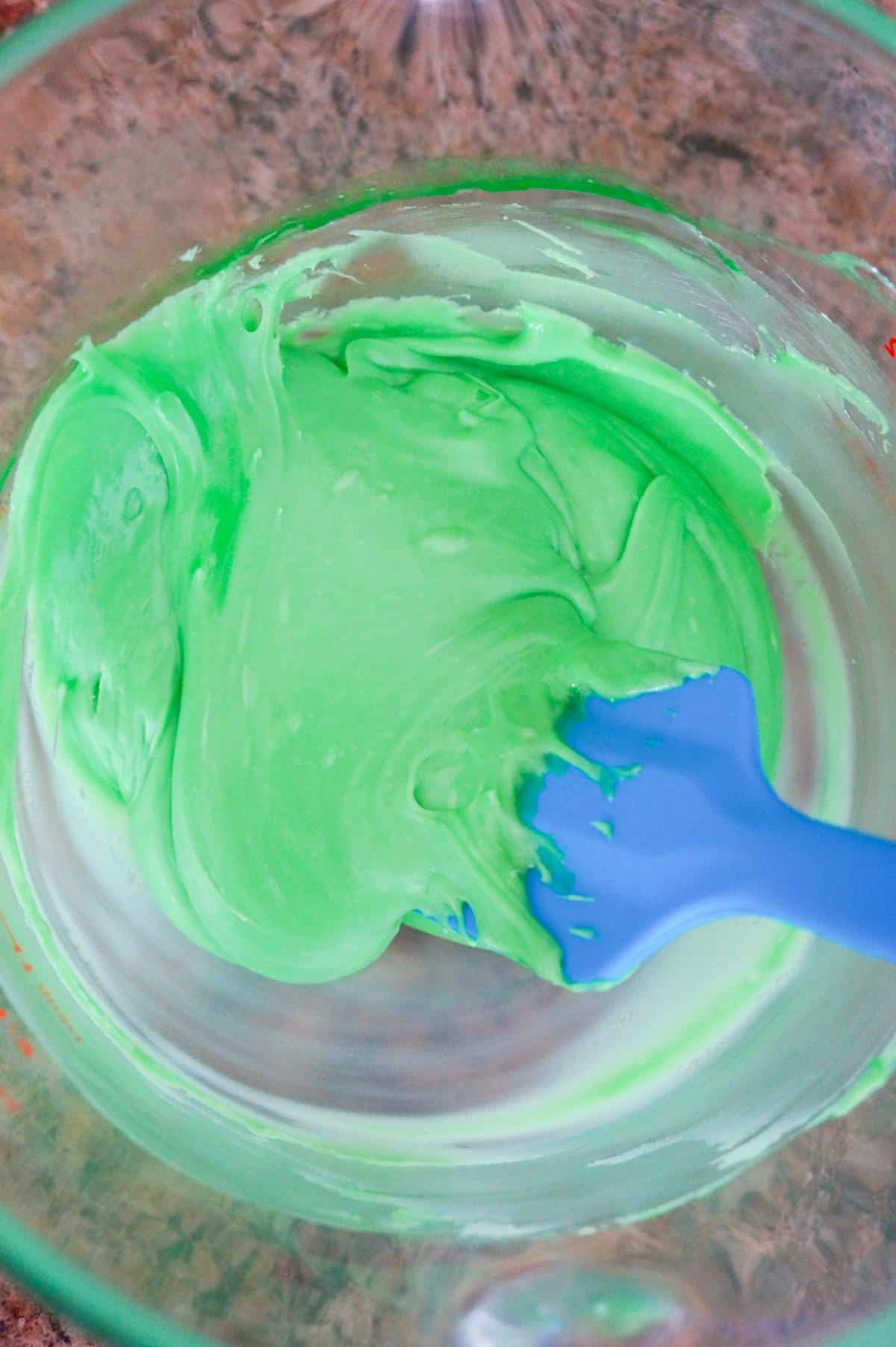 melted green chocolate mixture in a glass bowl