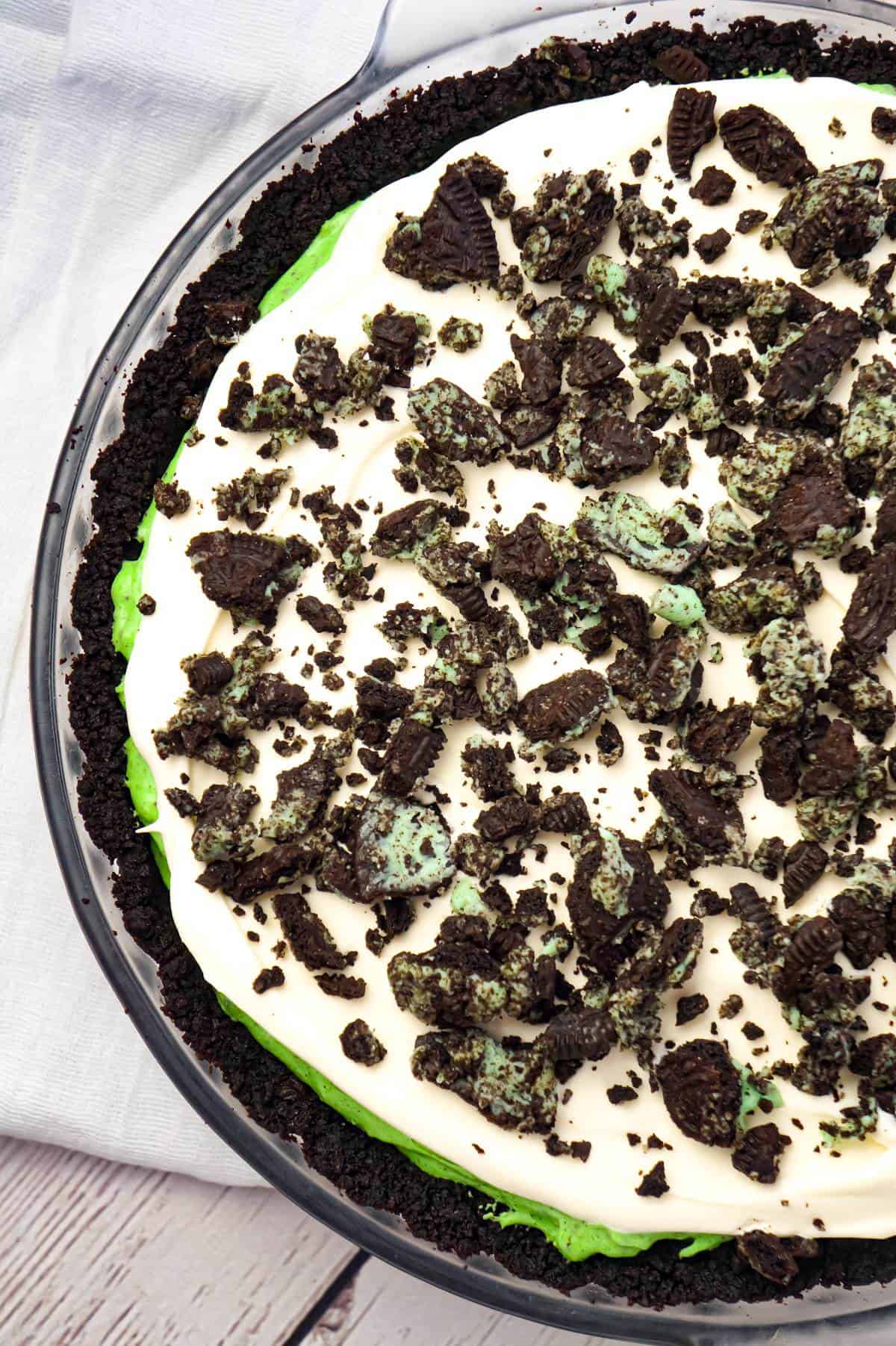 Mint Oreo Pie is an easy no bake dessert recipe with a creamy mint Oreo pudding filling, topped with Cool Whip, all in an Oreo crust.