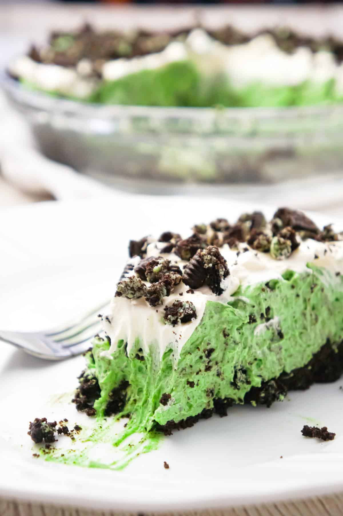 Mint Oreo Pie is an easy no bake dessert recipe with a creamy mint Oreo pudding filling, topped with Cool Whip, all in an Oreo crust.