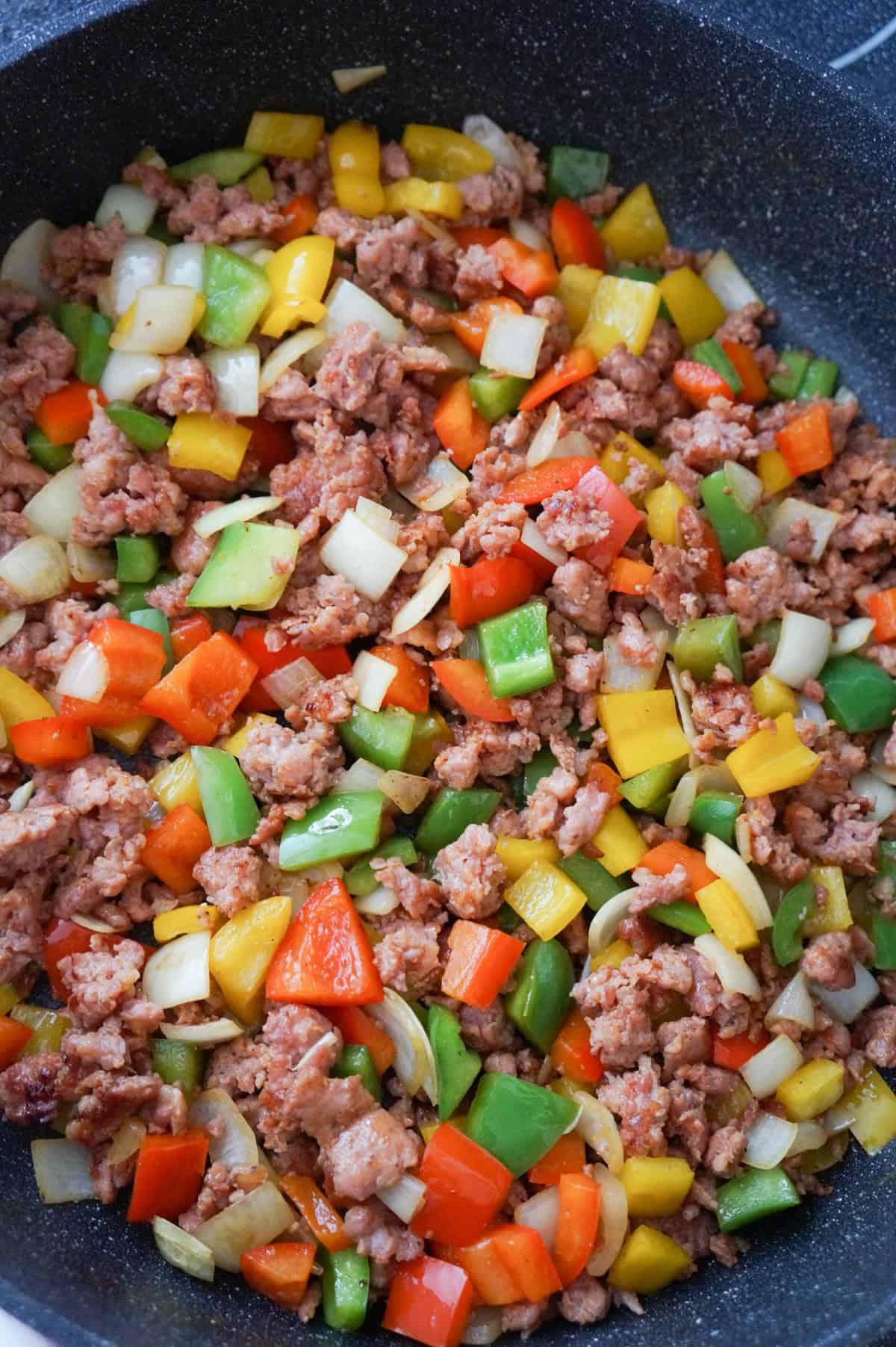 sausage and peppers mixture in a saute pan