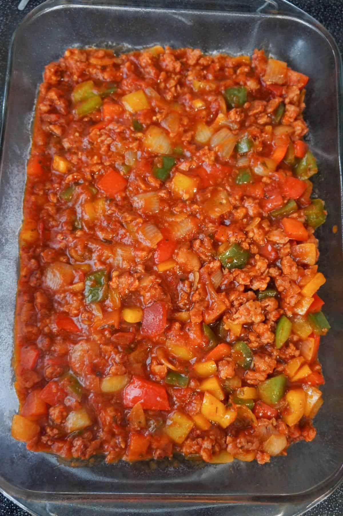 sausage and peppers mixture in a baking dish