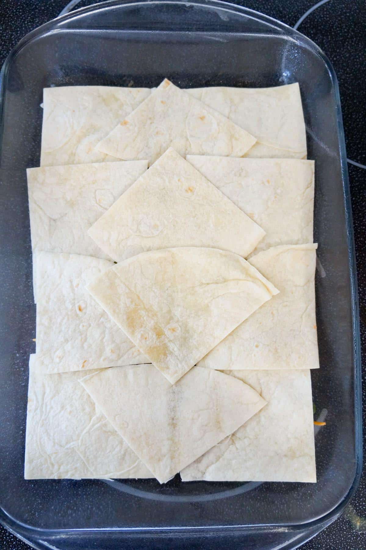 flour tortilla quarters in a 9 x 13 inch baking dish