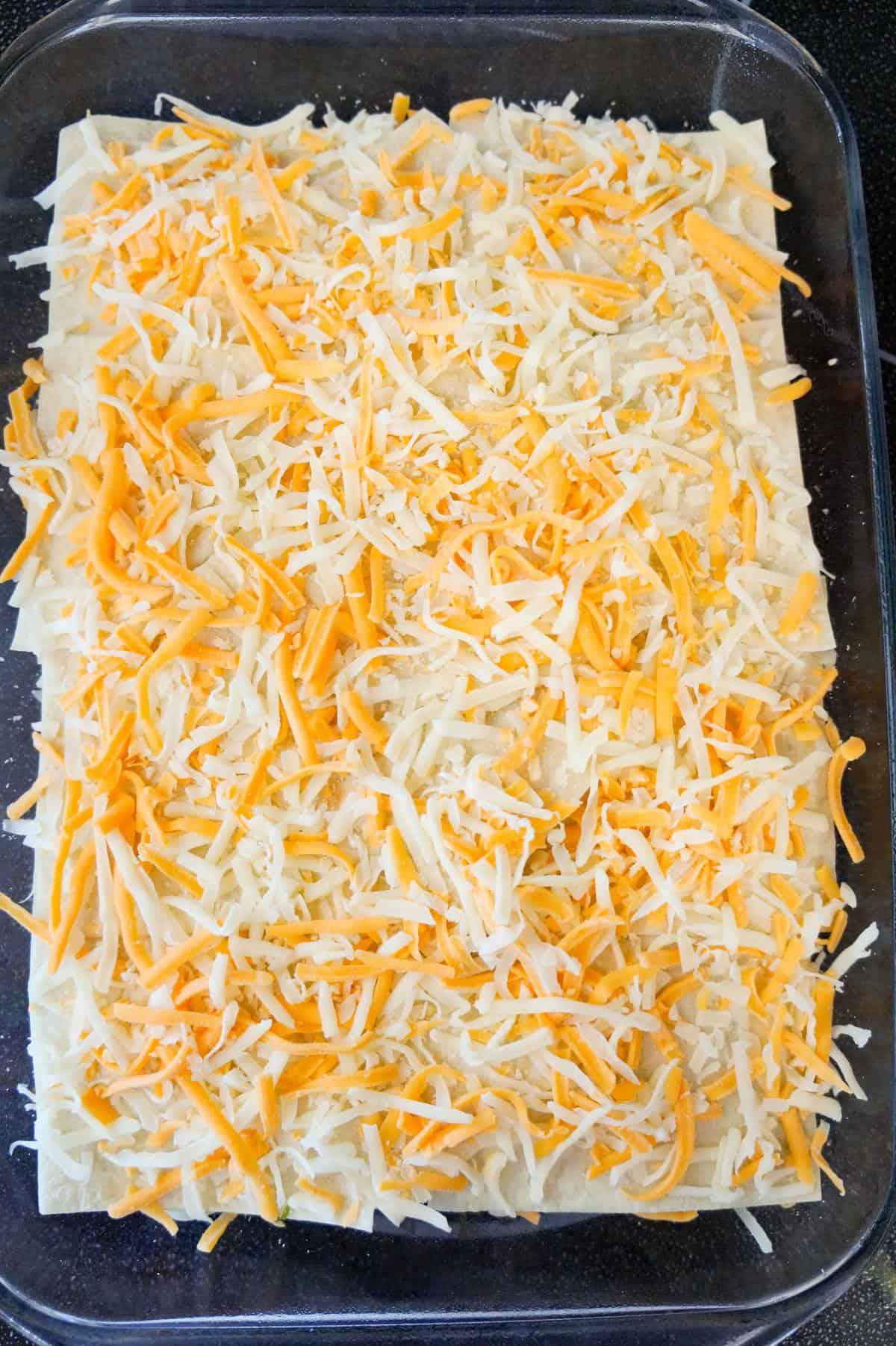 shredded cheese on top of taco lasagna