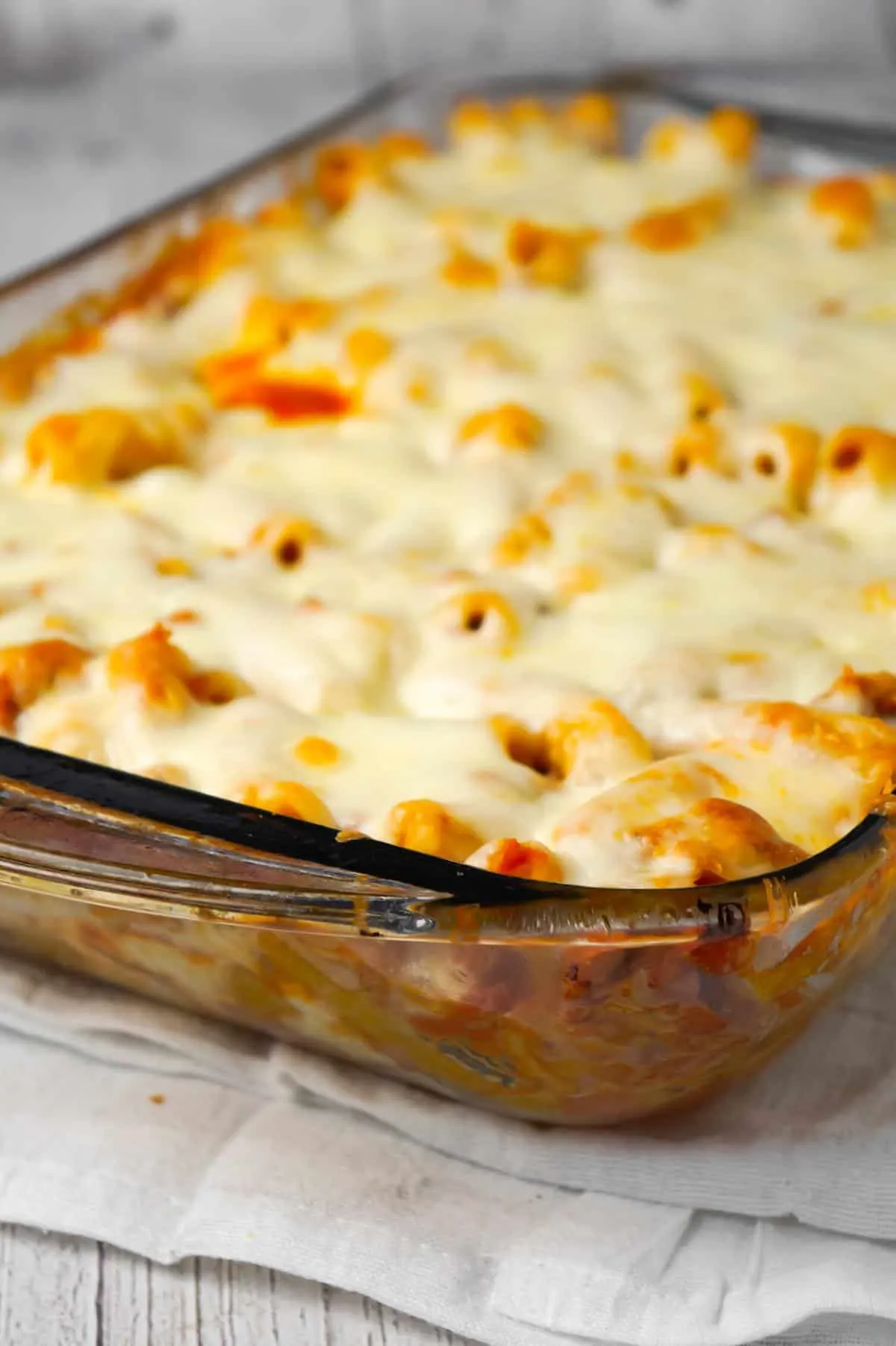 Baked Ziti with Sausage is an easy pasta recipe loaded with crumbled Italian sausage meat, marinara sauce, chunks of string cheese and shredded mozzarella.