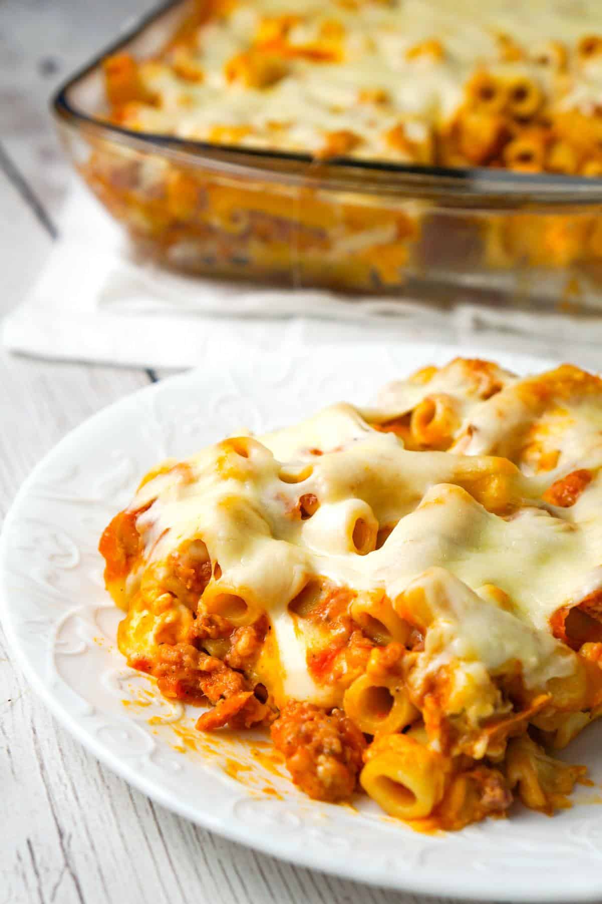 Baked Ziti with Sausage is an easy pasta recipe loaded with crumbled Italian sausage meat, marinara sauce, chunks of string cheese and shredded mozzarella.