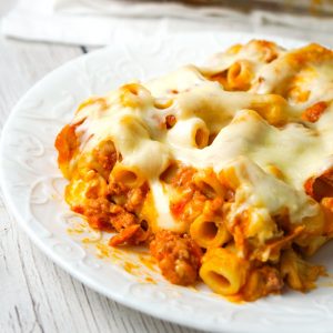 Baked Ziti with Sausage is an easy pasta recipe loaded with crumbled Italian sausage meat, marinara sauce, chunks of string cheese and shredded mozzarella.