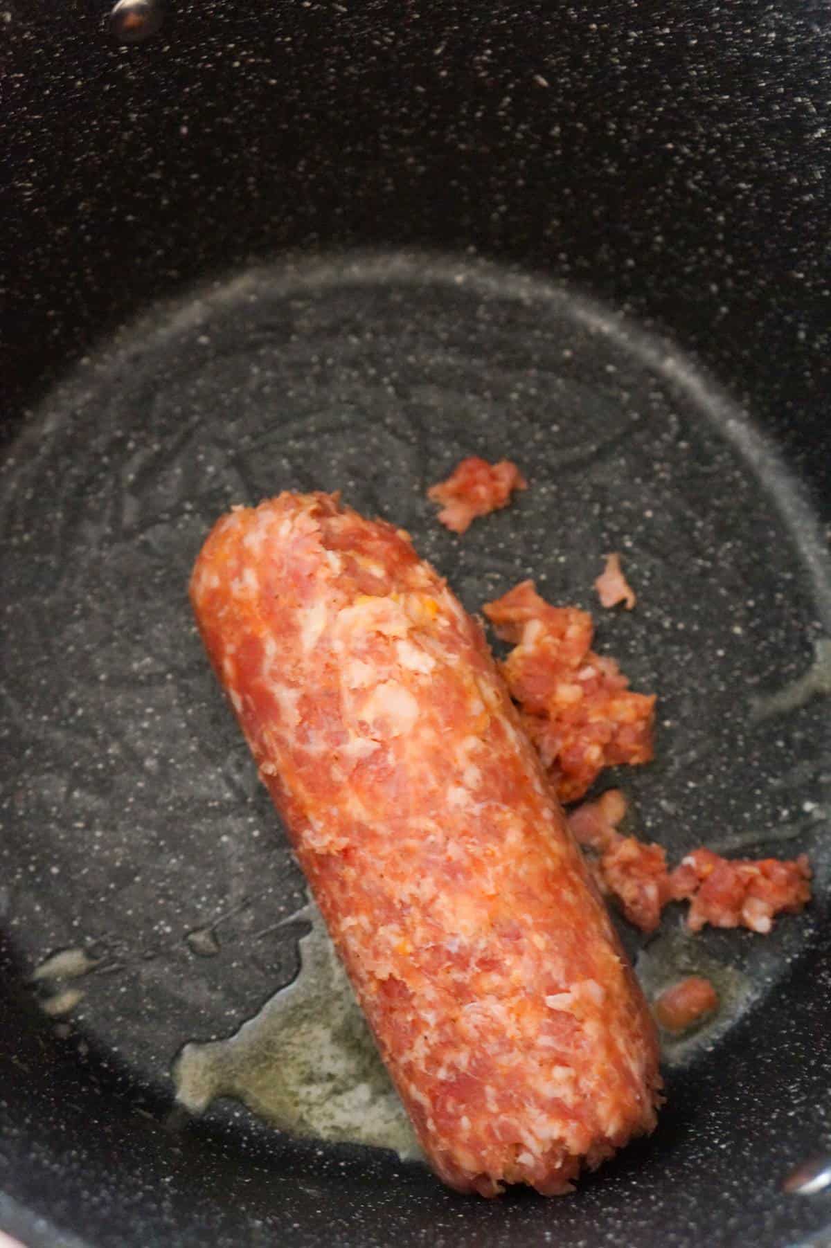 raw Italian sausage meat in a large pot
