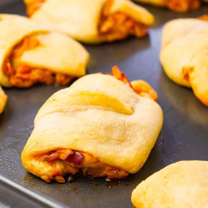 BBQ Chicken Crescent Rolls are an easy weeknight dinner recipe using shredded rotisserie chicken, diced red onions, Sweet Baby Ray's Barbecue sauce, shredded cheese and Pillsbury crescent rolls.