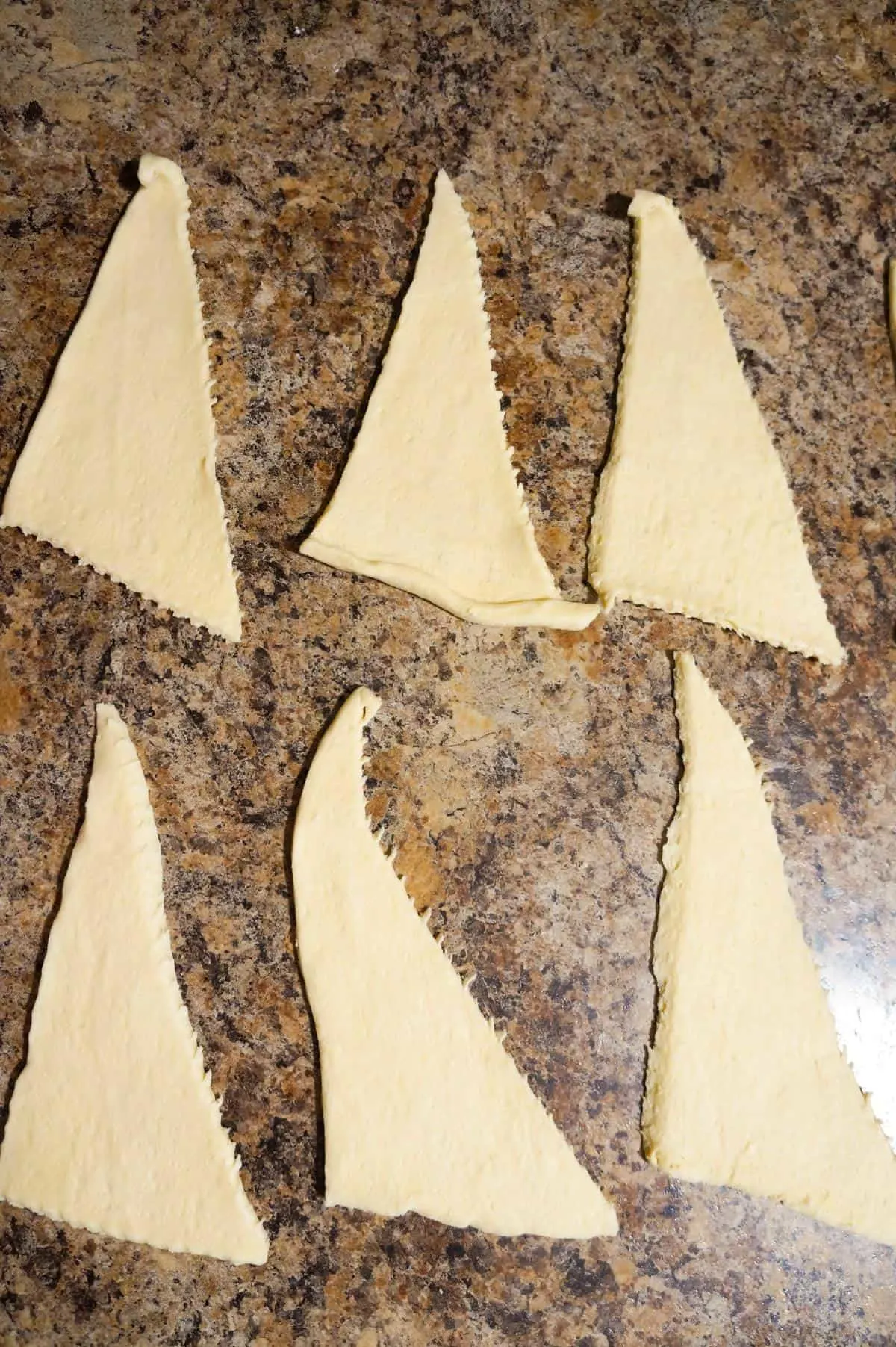 triangles of Pillsbury crescent dough on the counter