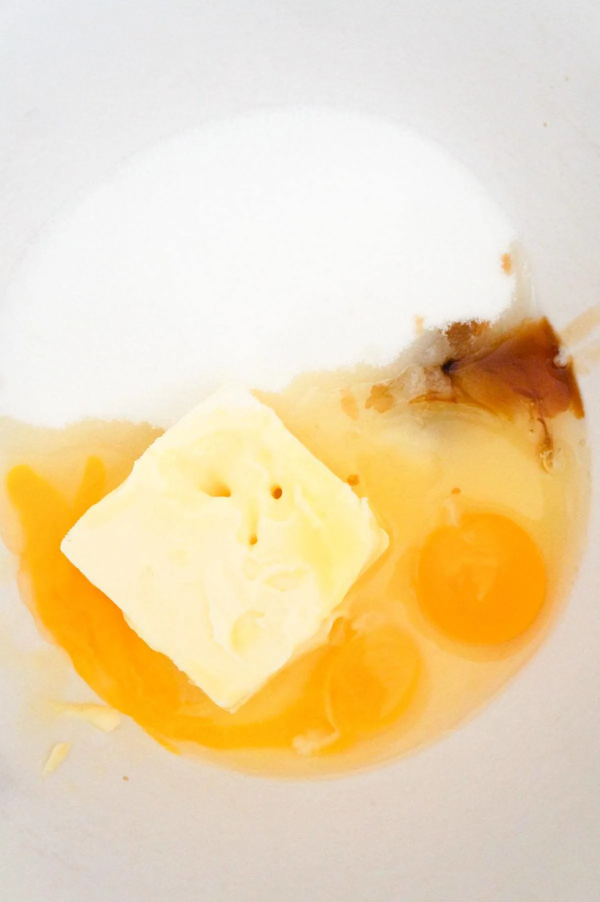 sugar, softened butter, eggs and vanilla extract in a mixing bowl
