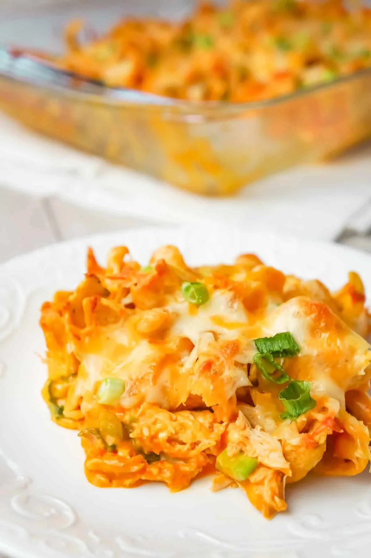 Buffalo Chicken Frito Pie is an easy casserole recipe using shredded rotisserie chicken and diced celery tossed in Buffalo sauce and ranch dressing, all topped with Fritos corn chips and cheese.
