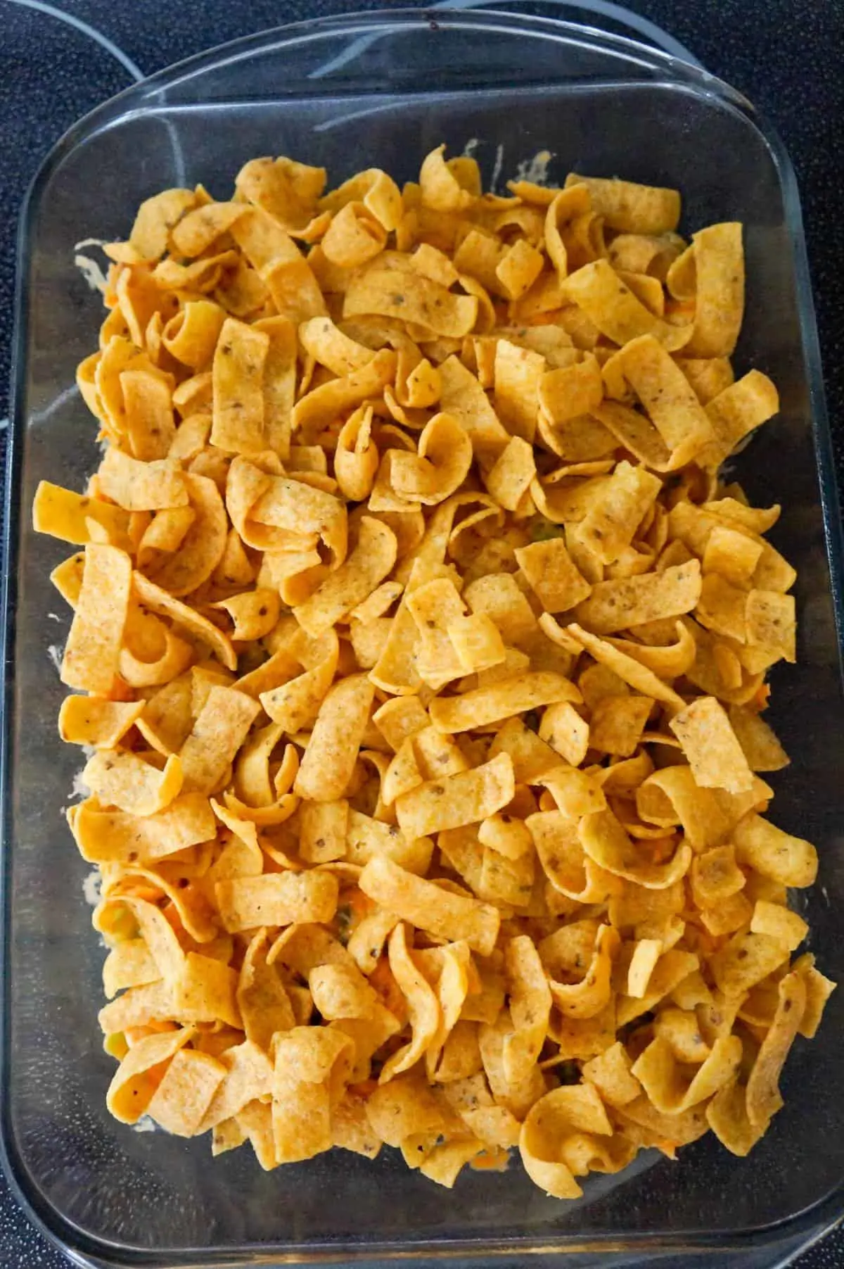 fritos corn chips on top of buffalo chicken mixture