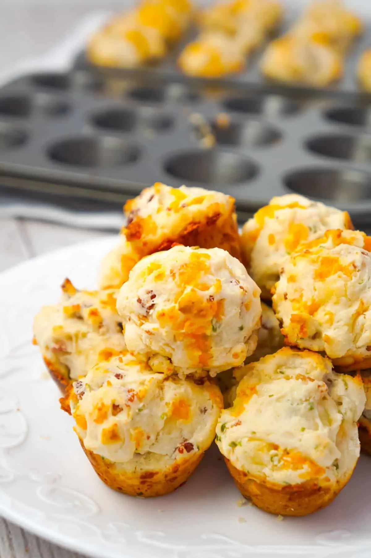 Cheddar Bacon Biscuit Bites are tasty little biscuits made with Bisquick, cheddar cheese and crumbled bacon and baked in mini muffin tins.