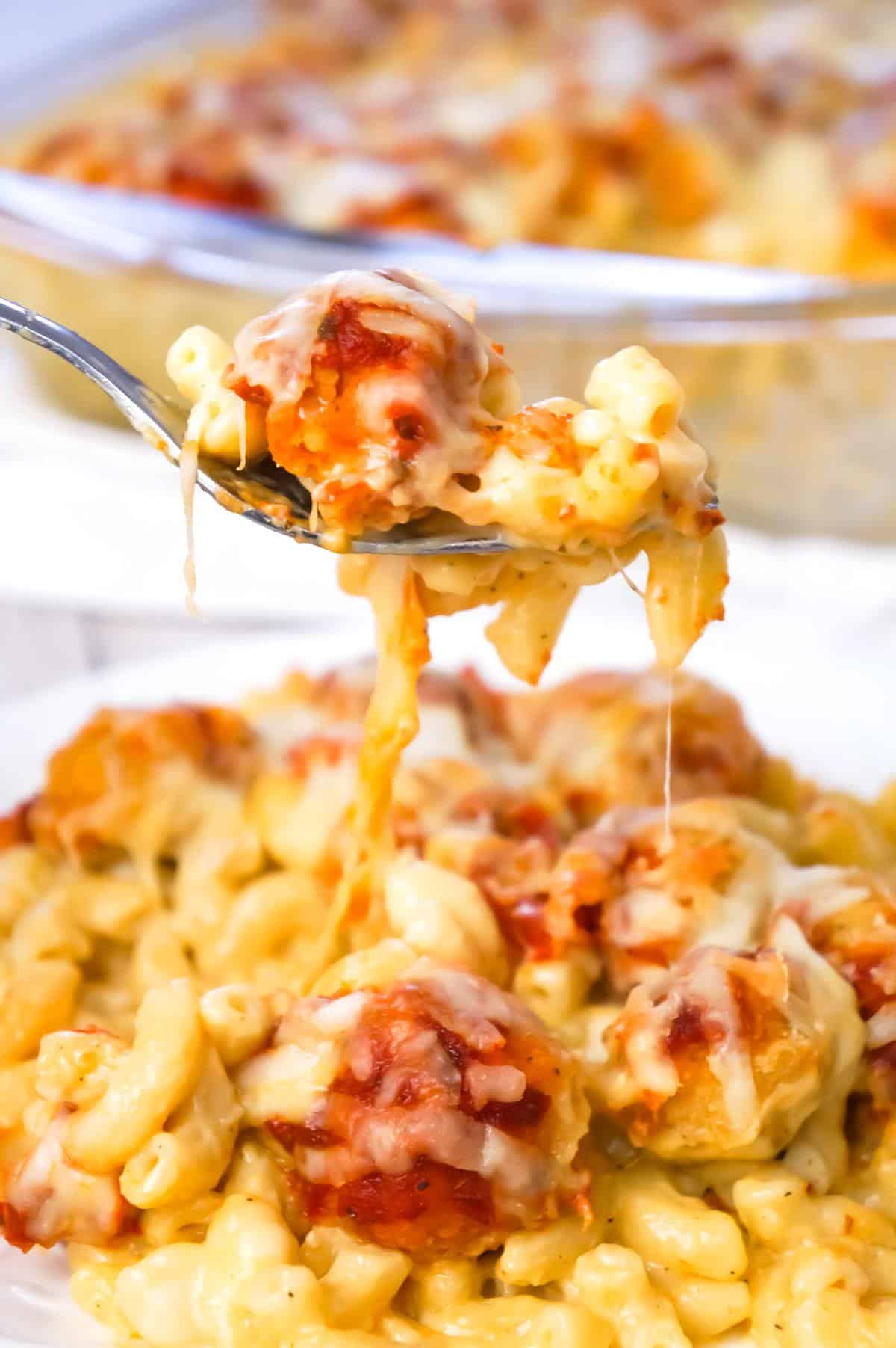 Chicken Parmesan Mac and Cheese is a hearty baked pasta recipe with a base of macaroni and cheese topped with popcorn chicken, marinara sauce and mozzarella cheese.