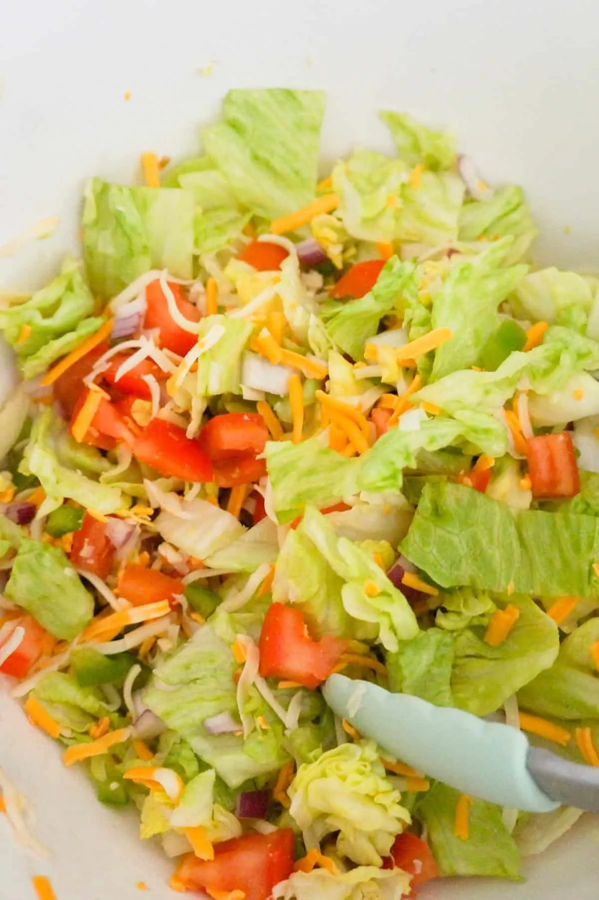tossed salad in a mixing bowl