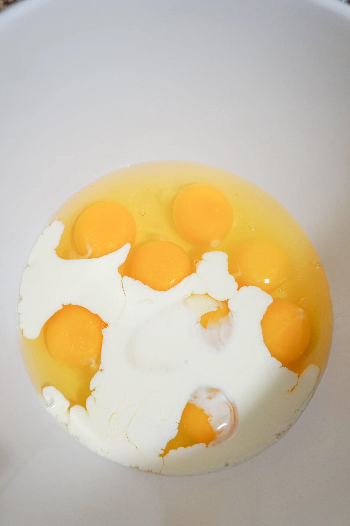 heavy cream and eggs in a mixing bowl