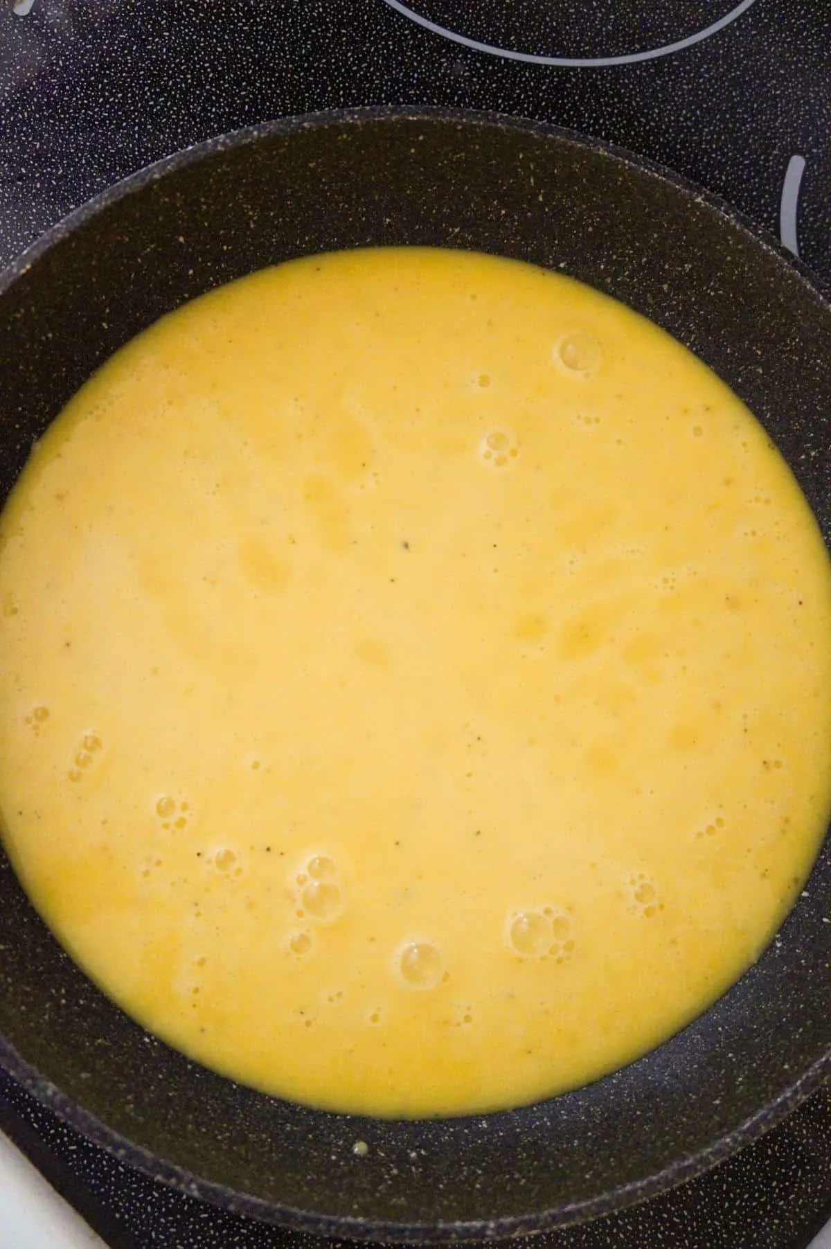 beaten eggs in a saute pan