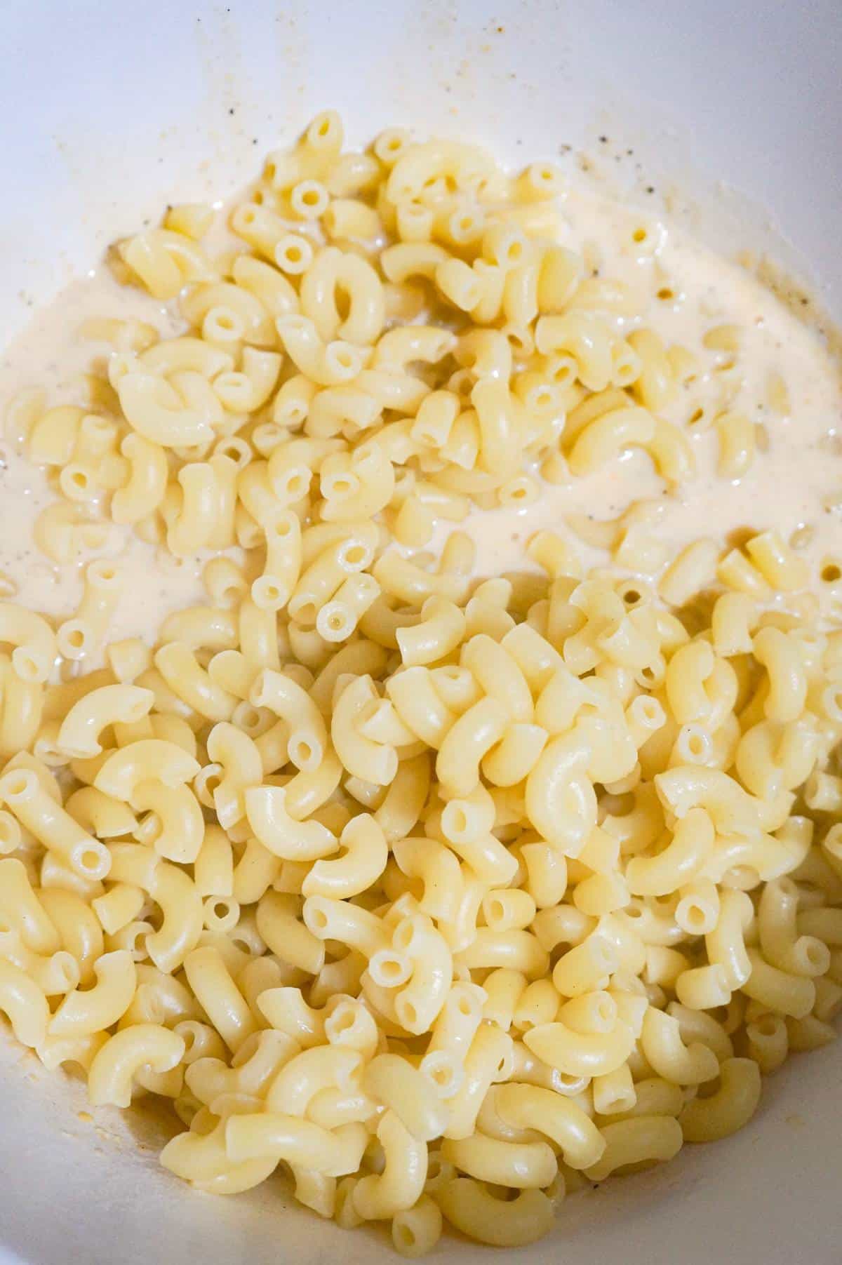 macaroni and milk mixture in a mixing bowl