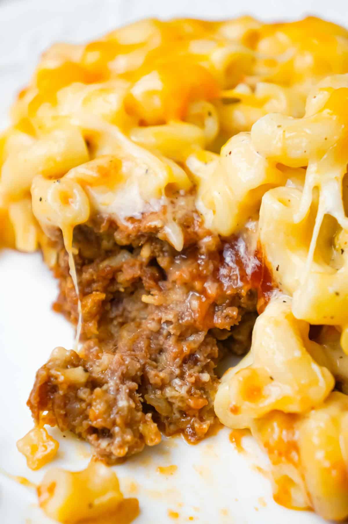 Mac and Cheese Meatloaf Casserole is a hearty dinner recipe with a ground beef meatloaf base with macaroni and cheese baked on top.