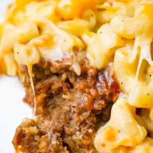 Mac and Cheese Meatloaf Casserole is a hearty dinner recipe with a ground beef meatloaf base with macaroni and cheese baked on top.