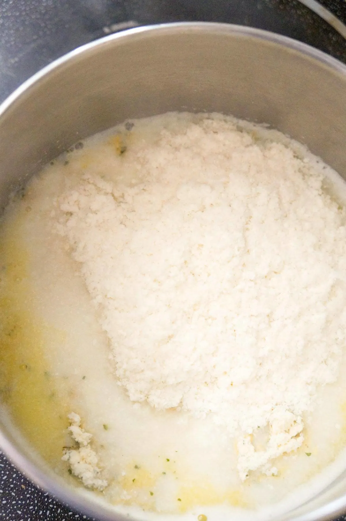 instant mashed potato mix on top of water and milk in a pot