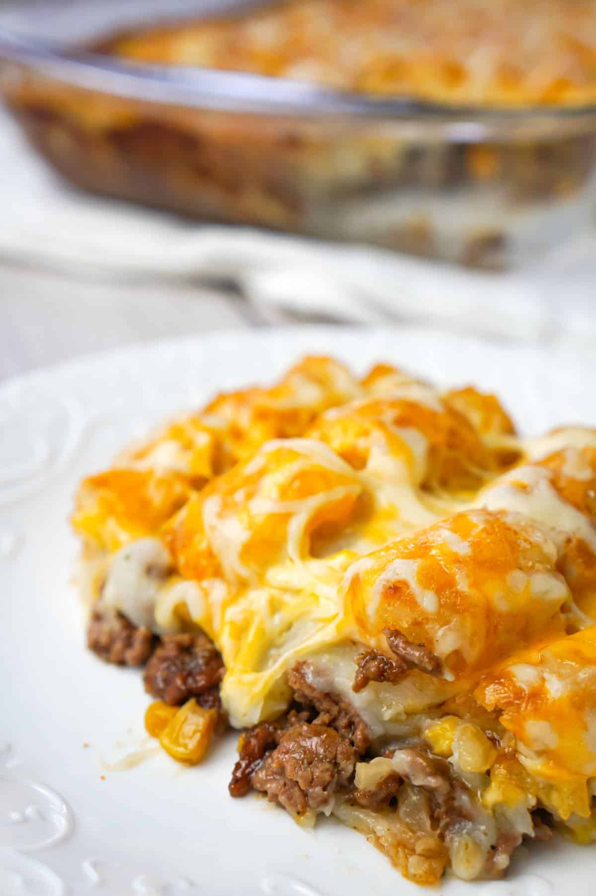 Shepherd's Pie Tater Tot Casserole is a hearty casserole with ground beef, corn and diced onions topped with mashed potatoes, tater tots and shredded cheese.